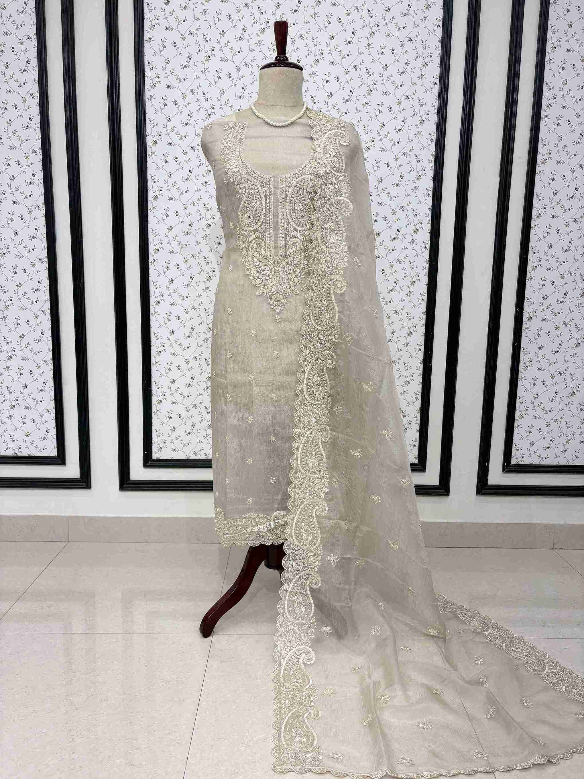 Beige marble chiffon unstitched suit full front view with paisley cutwork dupatta draped on mannequin