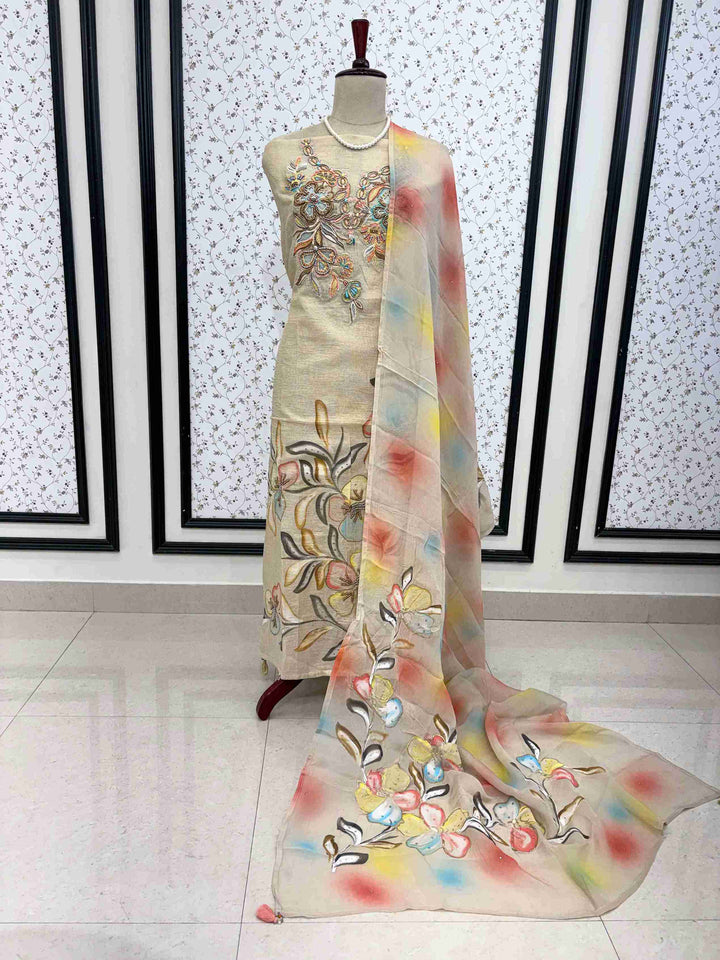 Beige tissue silk unstitched suit on manequinn