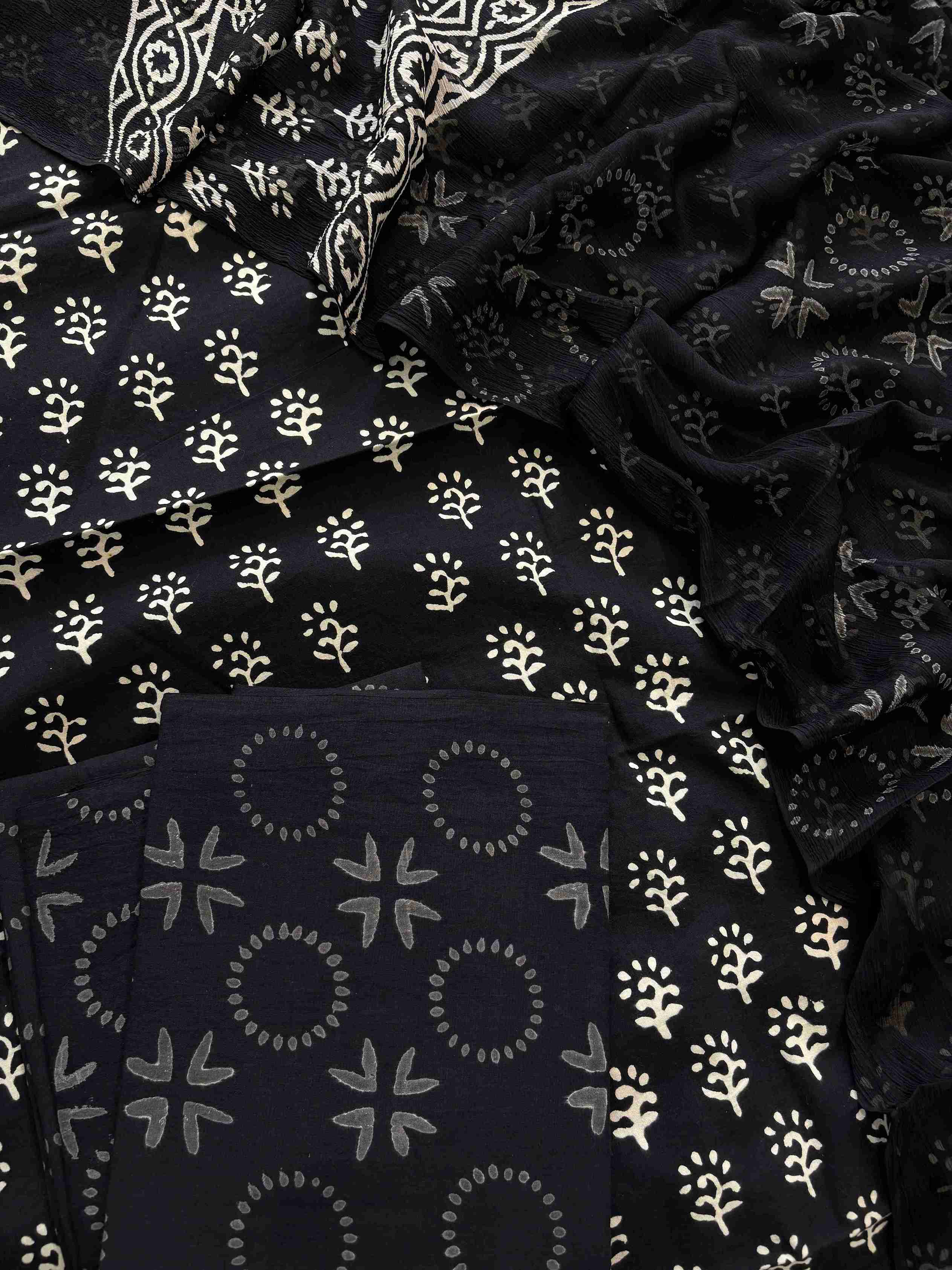 Close-up of black cotton kurta fabric with white Jaipuri handblock print