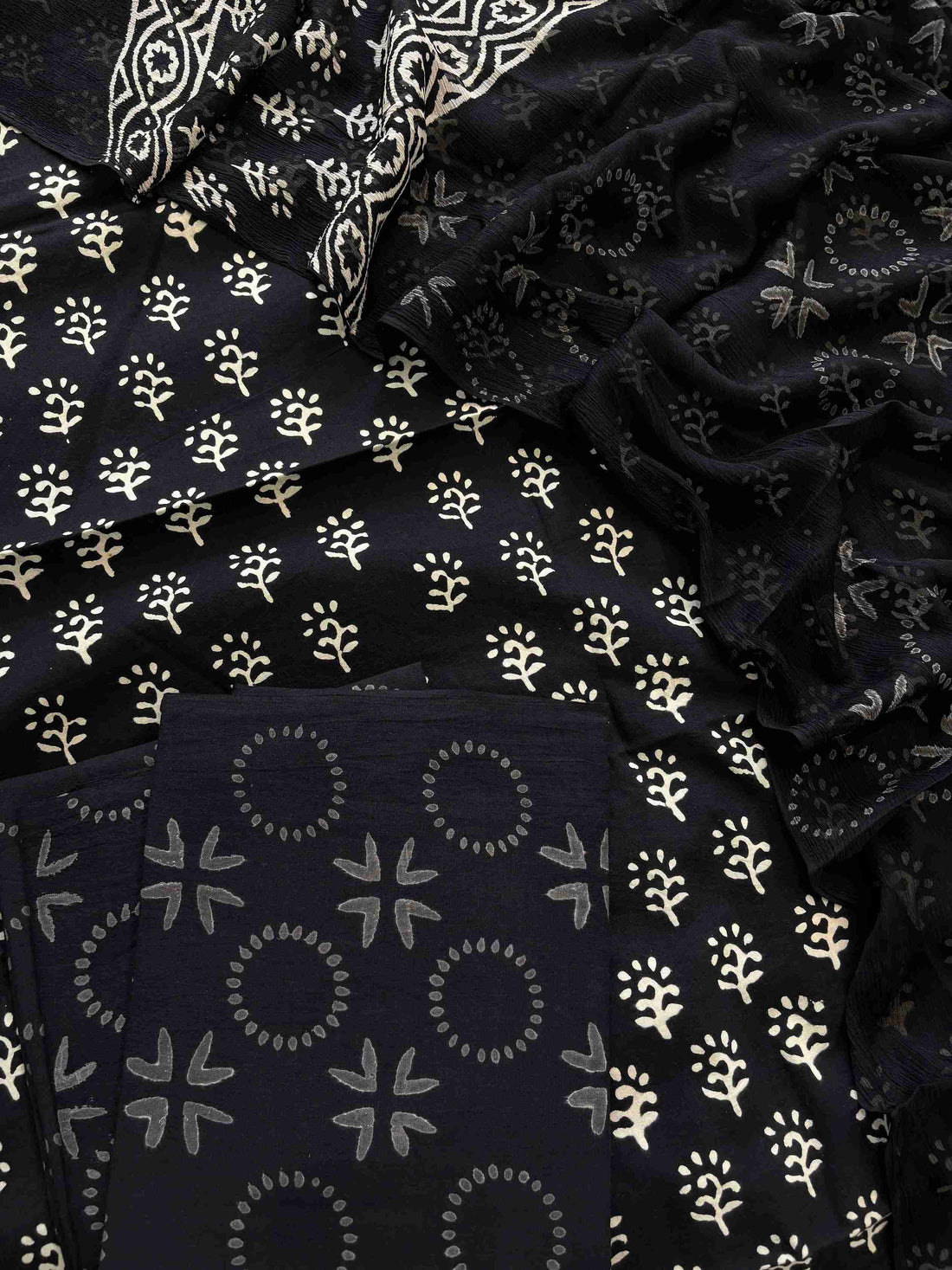 Close-up of black cotton kurta fabric with white Jaipuri handblock print