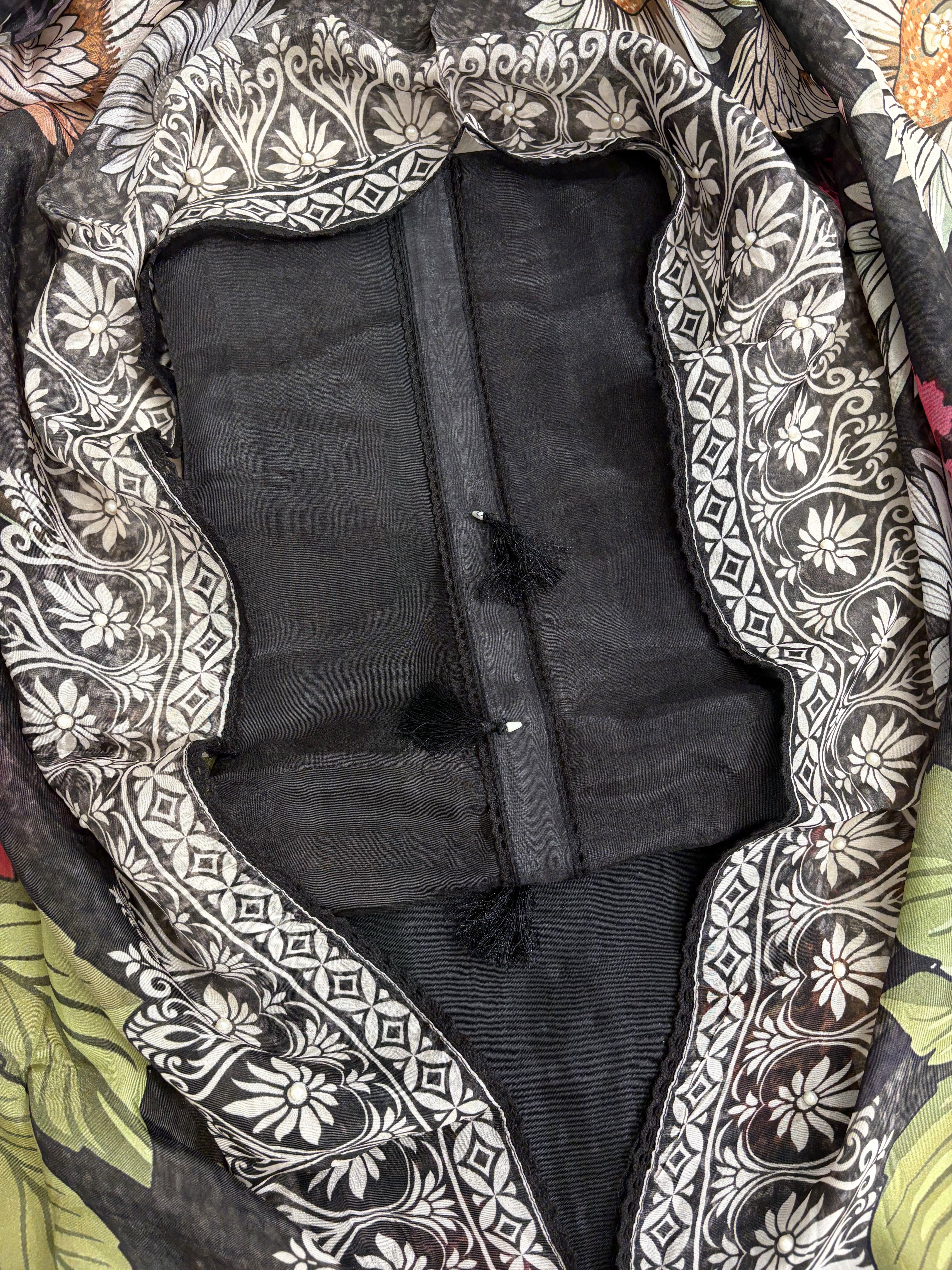 Black silk organza shirt base fabric close-up showing lustrous semi-sheer texture