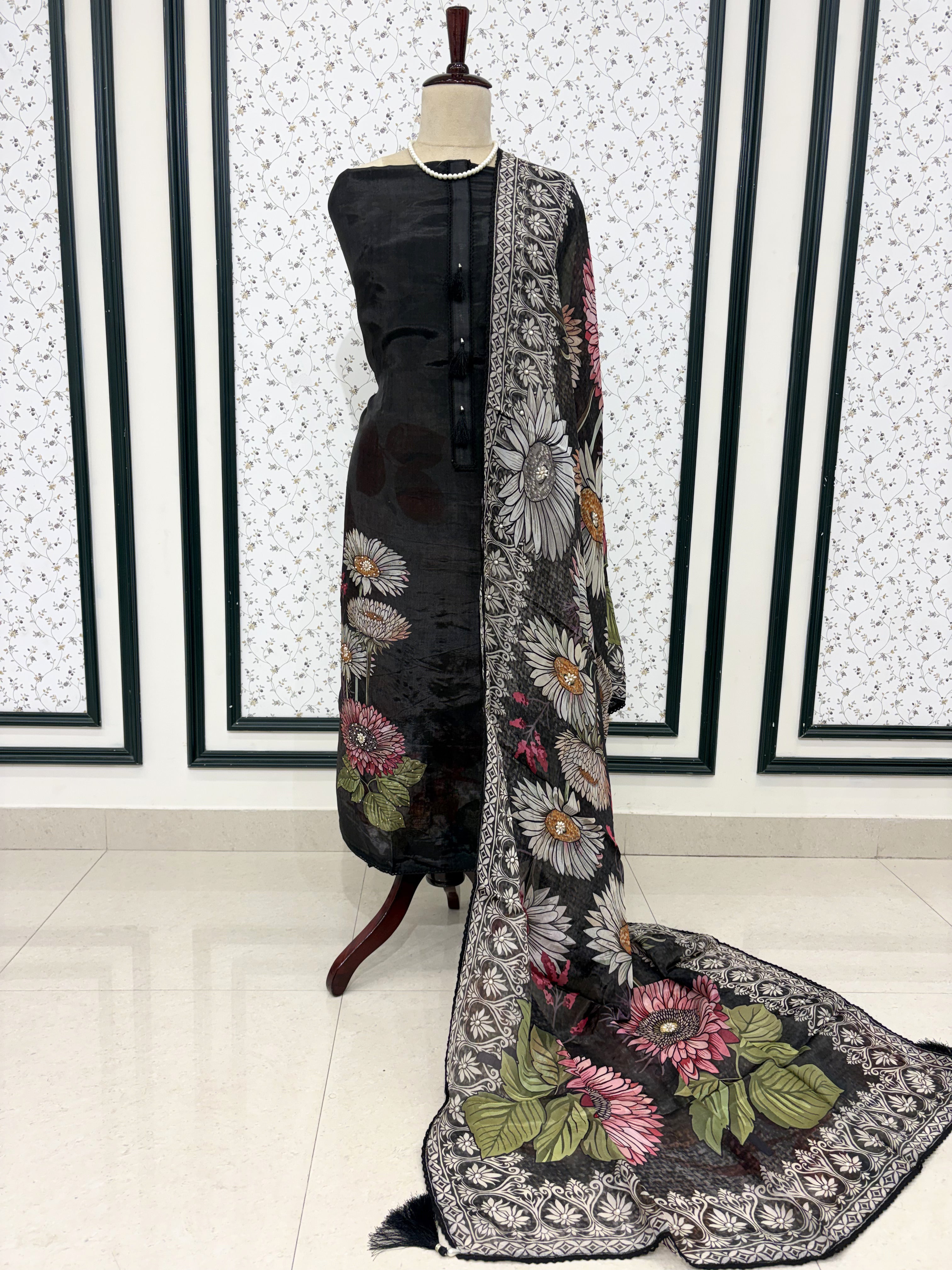 Black silk organza unstitched suit full front view with matching printed dupatta draped on mannequin