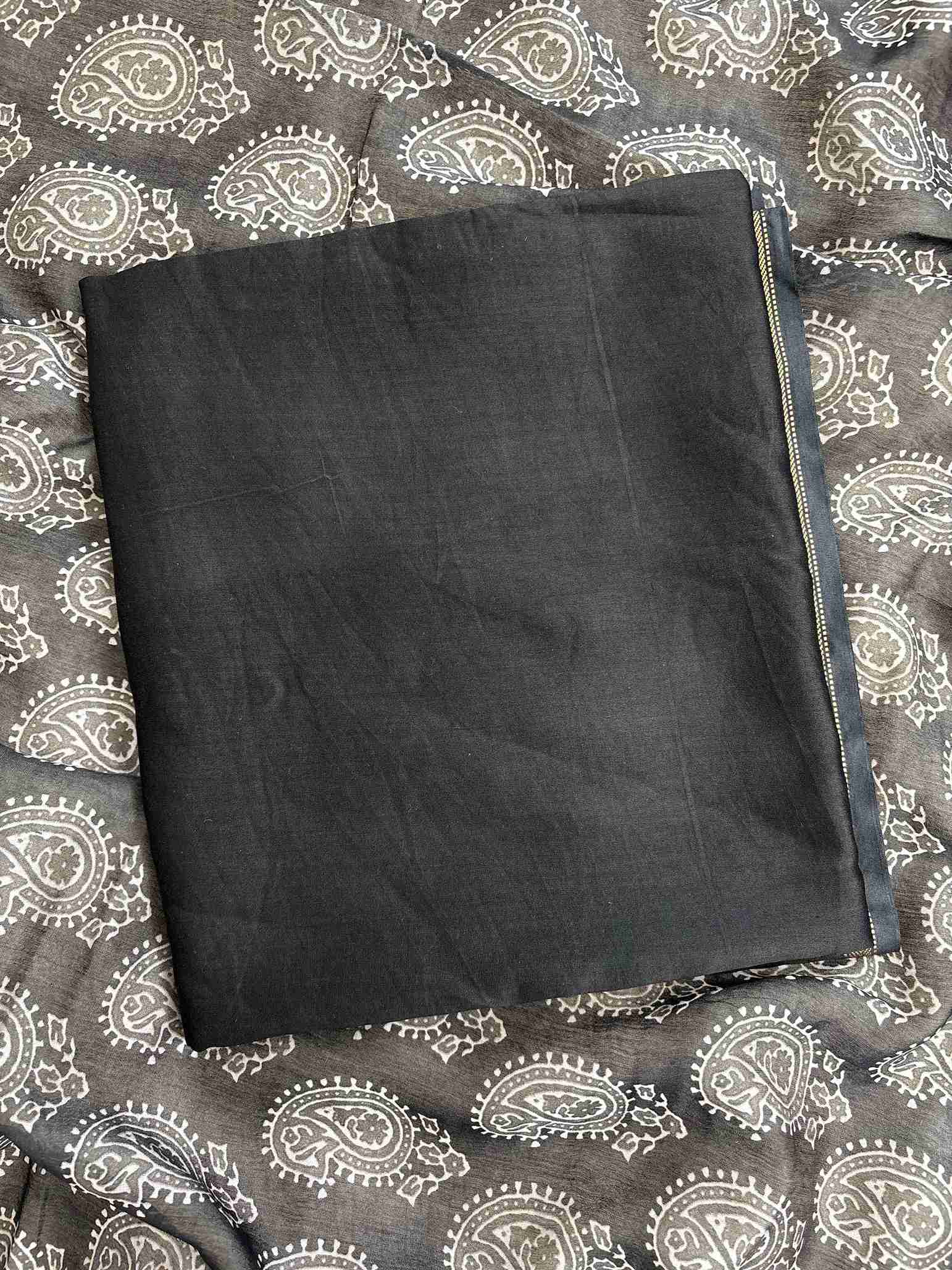 Close-up of digitally printed Ajrakh style dupatta on black Maheshwari silk suit