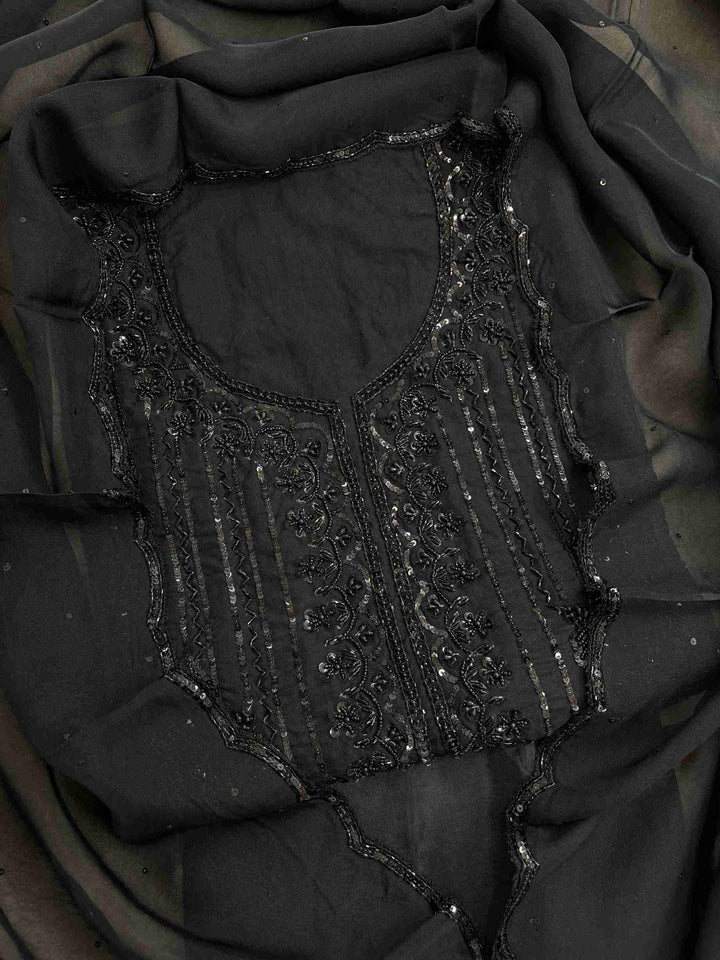 Black organza unstitched suit set with heavy black embellishments