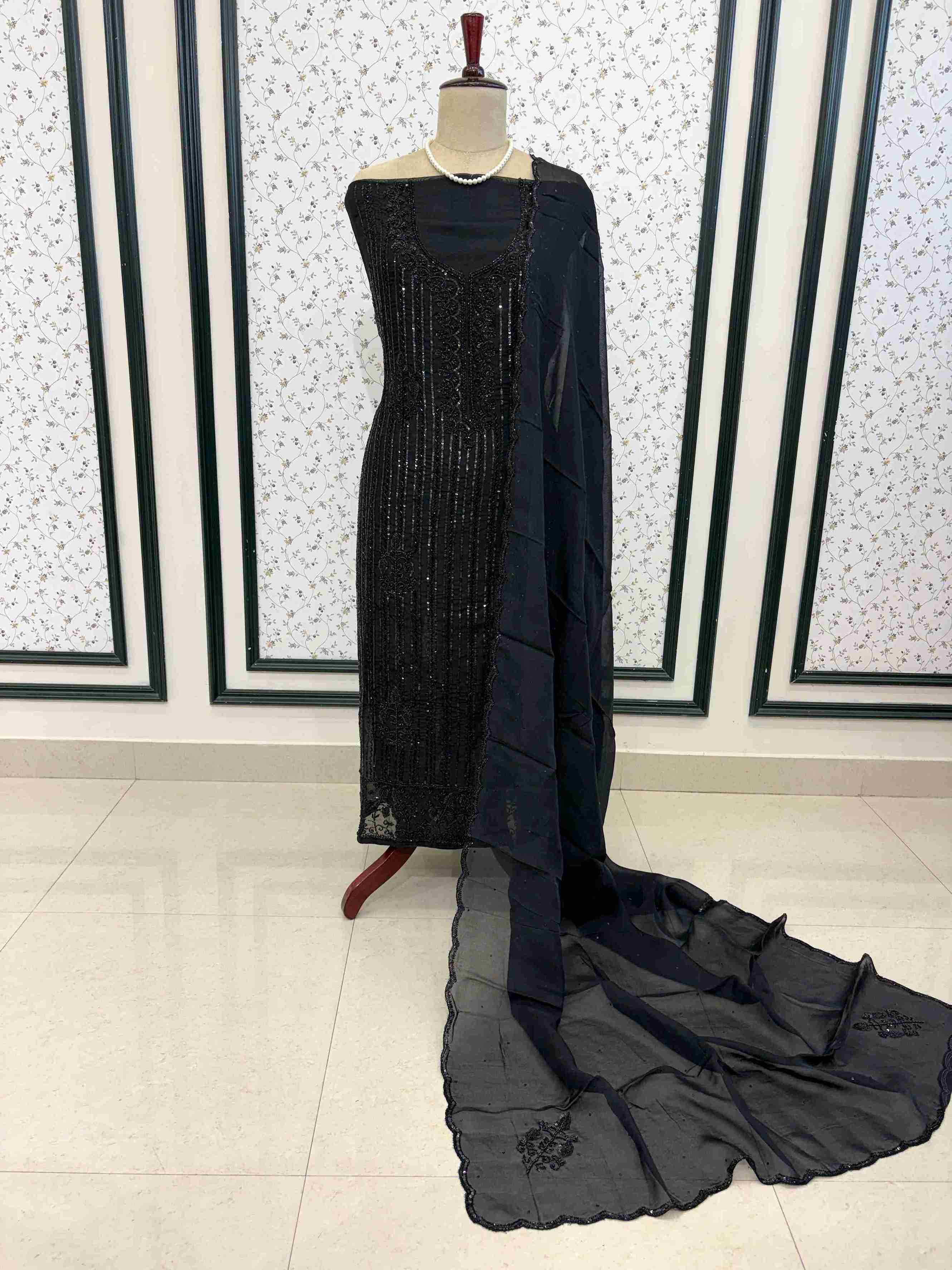 Black organza unstitched 3 piece suit with dense sequence and bead work on manequinn