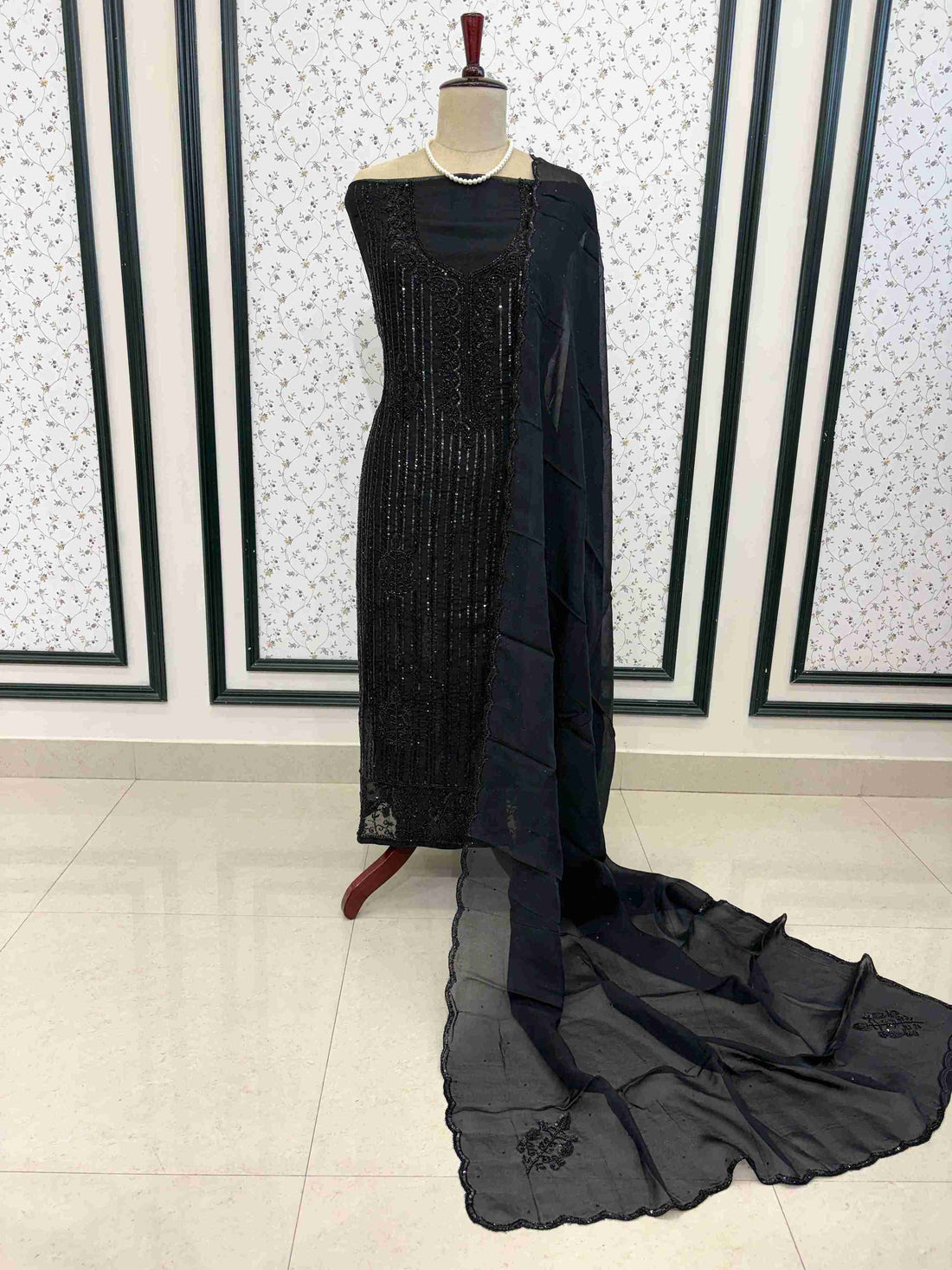 Black organza unstitched 3 piece suit with dense sequence and bead work on manequinn
