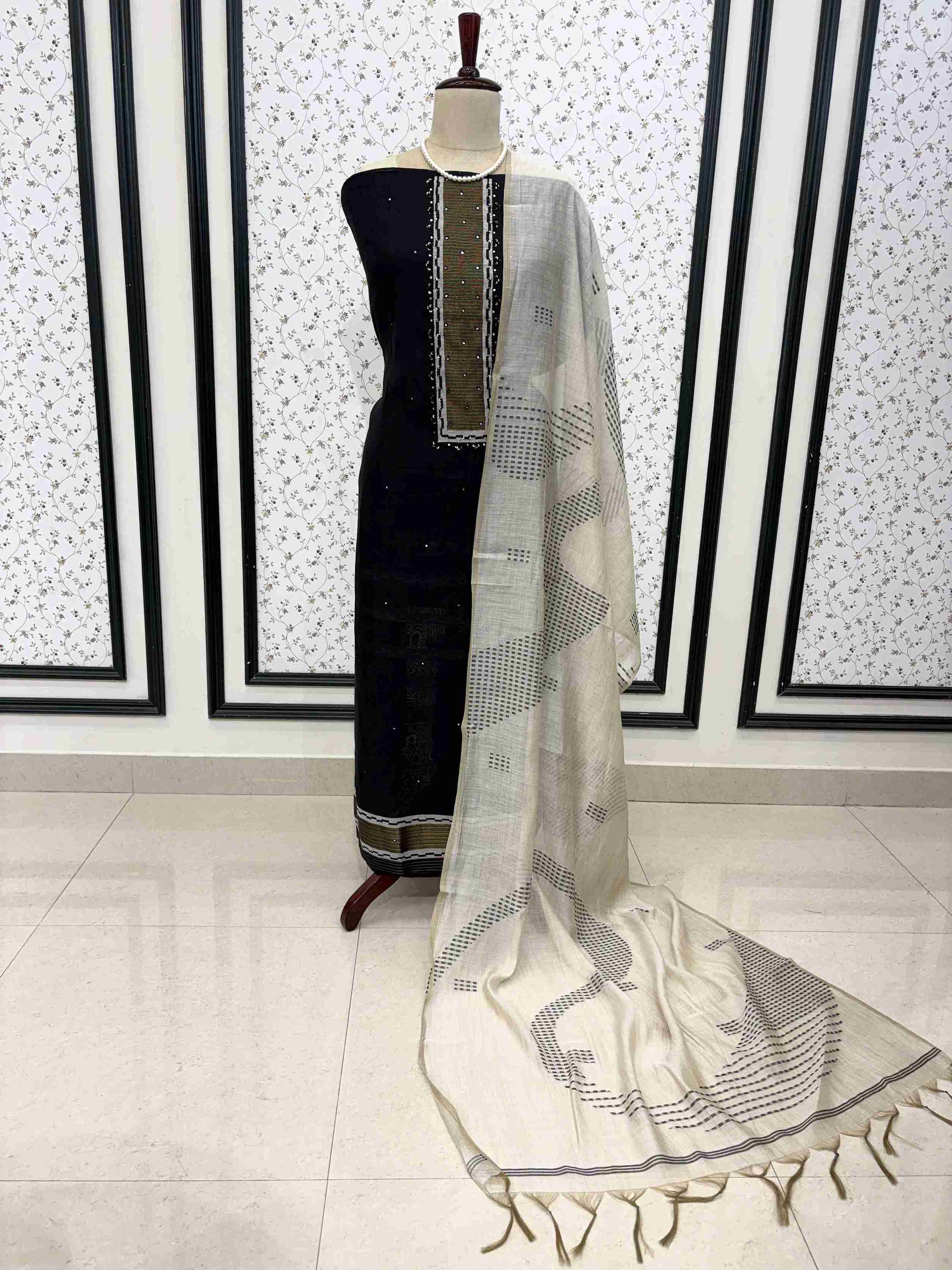 Black viscose unstitched suit set displayed on mannequin with mirror highlight neckline and dupatta