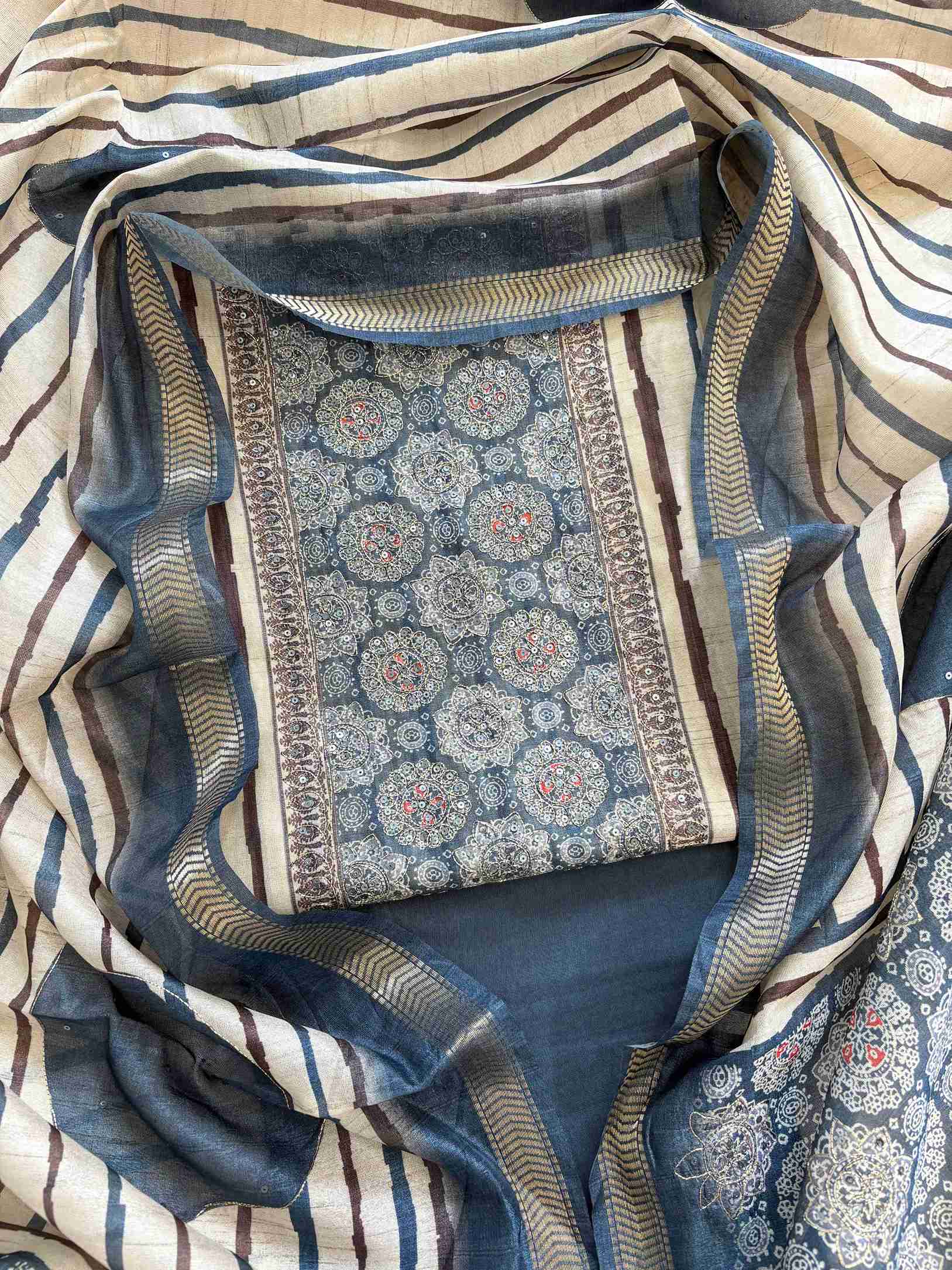Blue Chanderi unstitched suit with Ajrakh printed neckline and solid kurta design