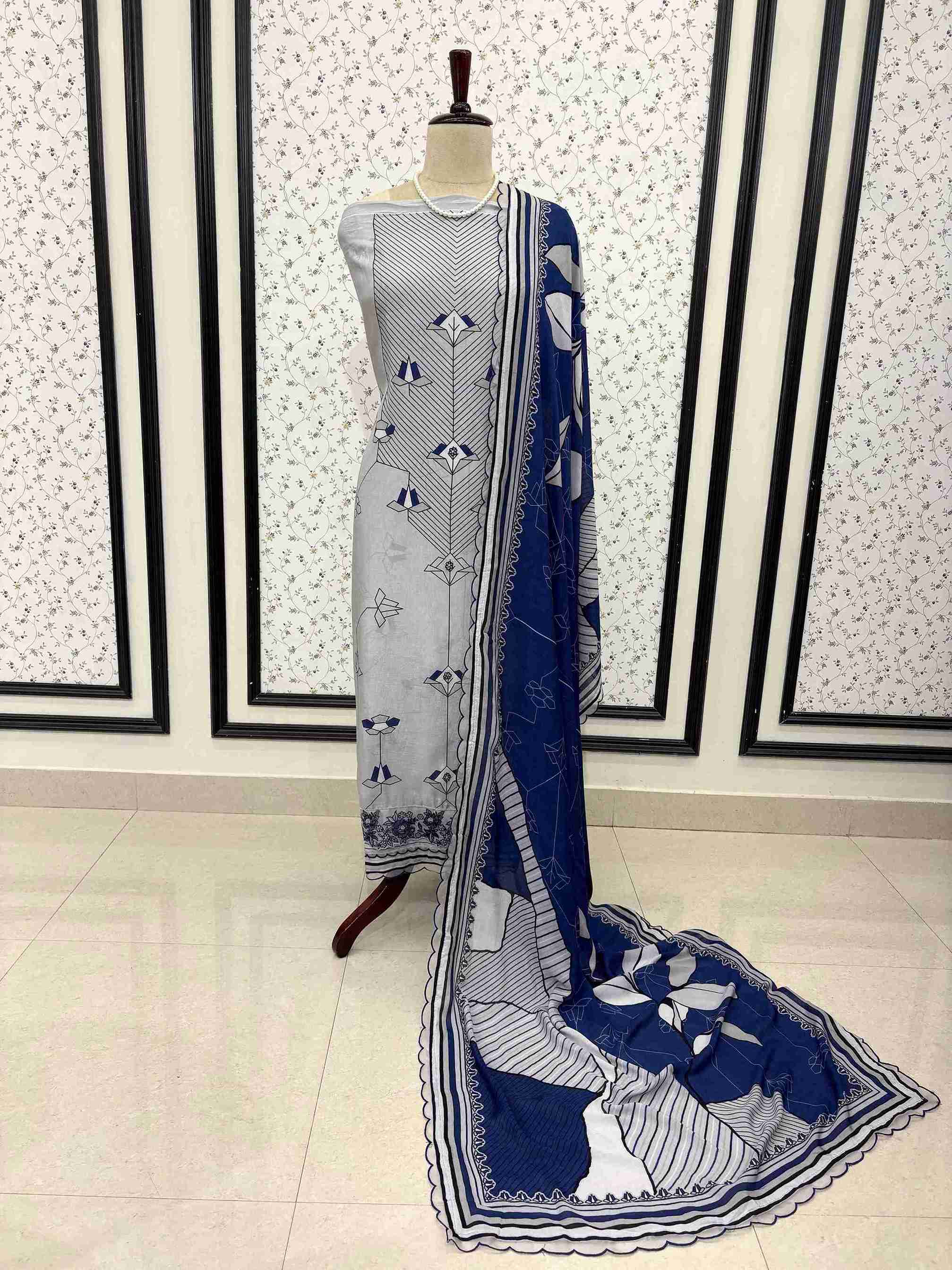 Blue grey pure muslin digital print unstitched suit set displayed on mannequin with embroidered organza border dupatta