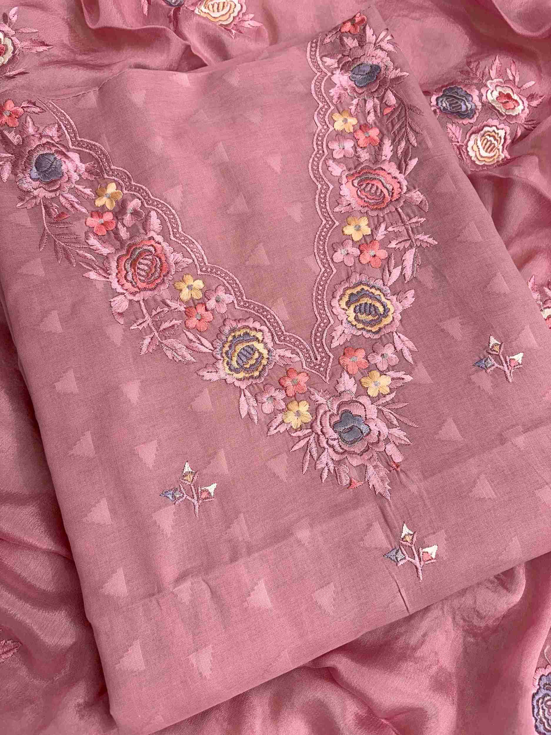 Floral thread embroidered V neckline on blush pink cotton suit with jacquard impression