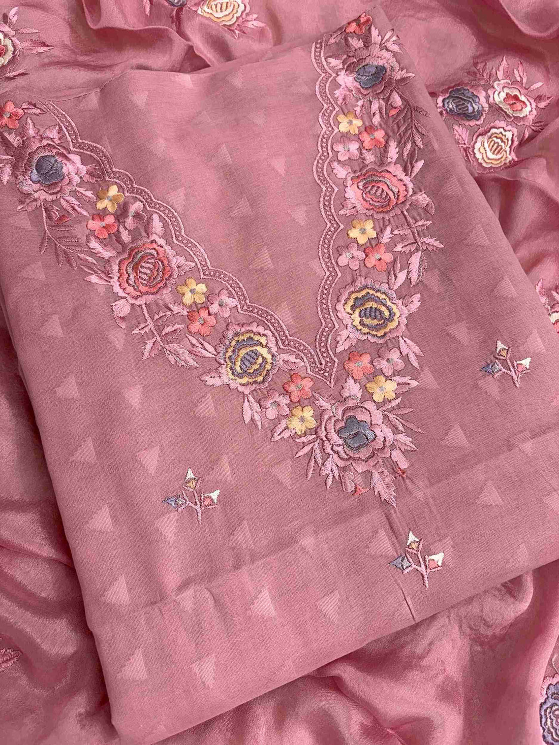 Floral thread embroidered V neckline on blush pink cotton suit with jacquard impression