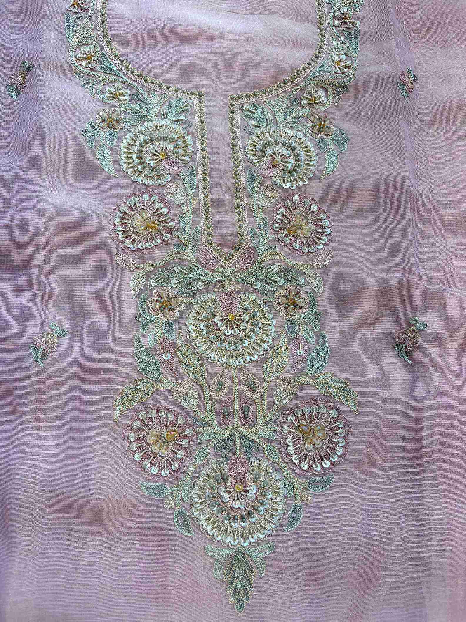 Flat lay of close-up of multicolor resham and zari embroidered neckline with sequins
