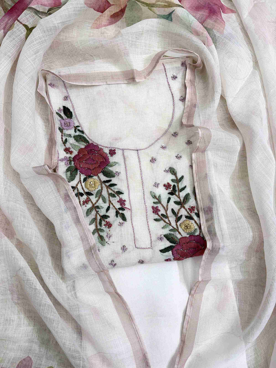 Scattered resham thread floral motifs on shirt body and 3D resham floral embroidery at daaman of blush pink linen shirt