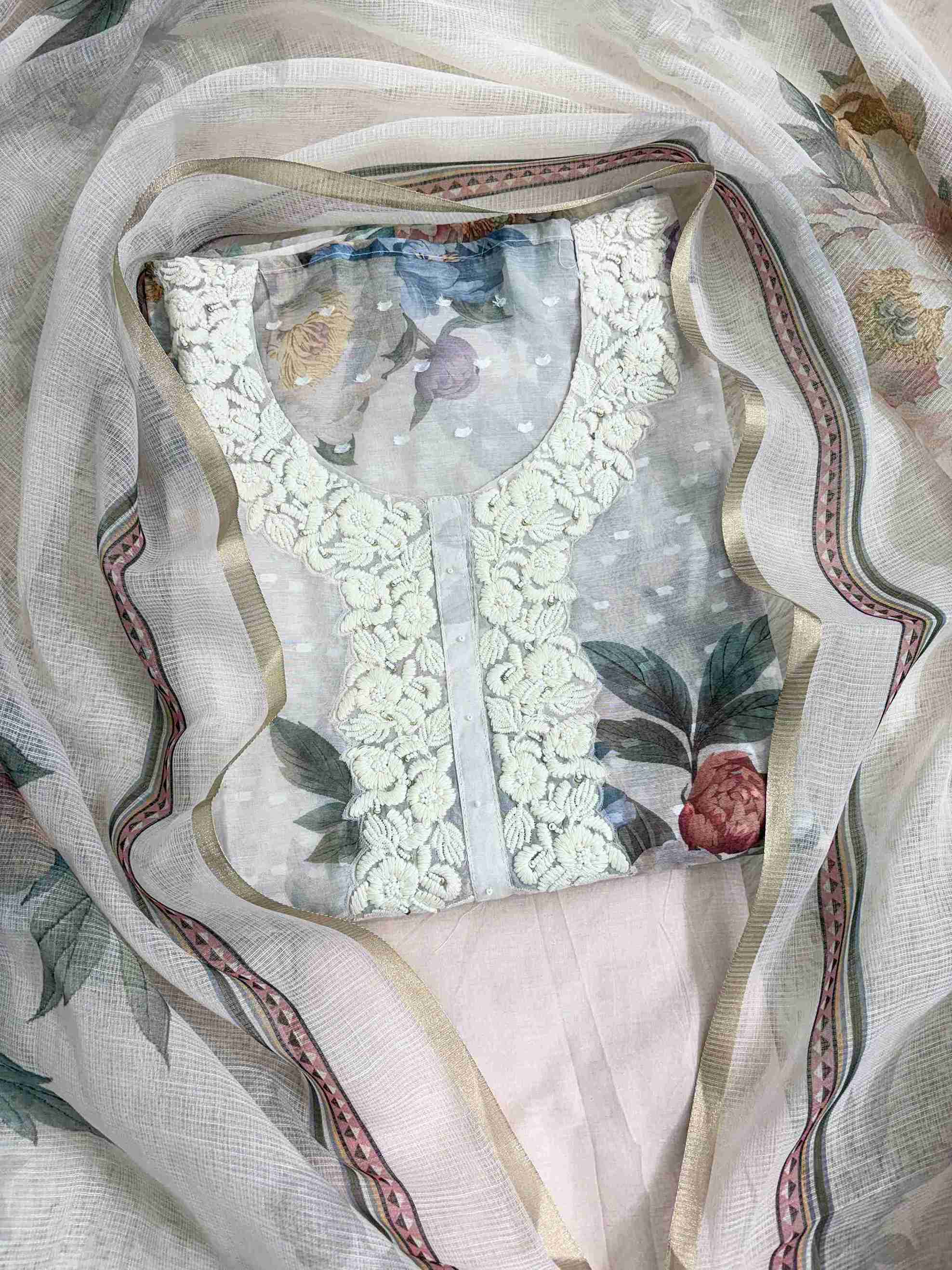 All-over digital peony floral print in pink, mauve, and green tones across blush white linen shirt body