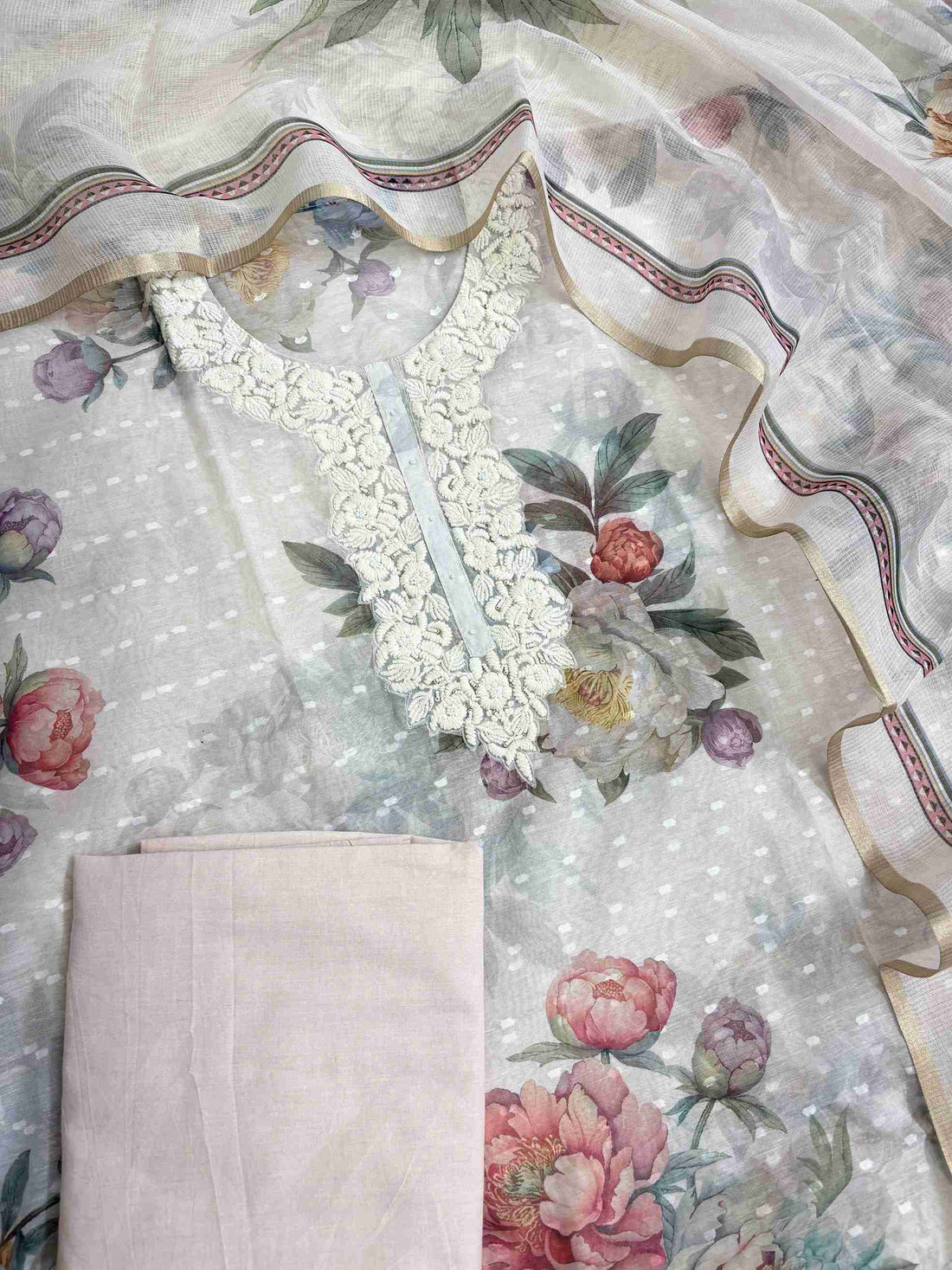 Complete blush white linen unstitched suit flat lay set with shirt, kota doriya dupatta, and cotton bottom