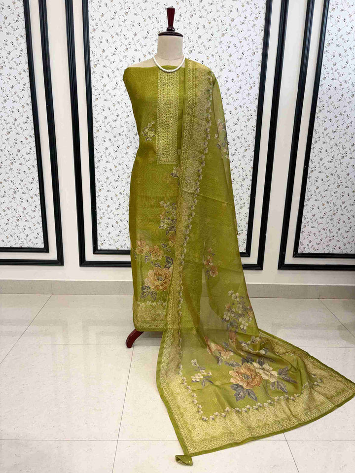 Complete bright olive green chanderi unstitched suit set with dupatta and cotton silk bottom on manequinn