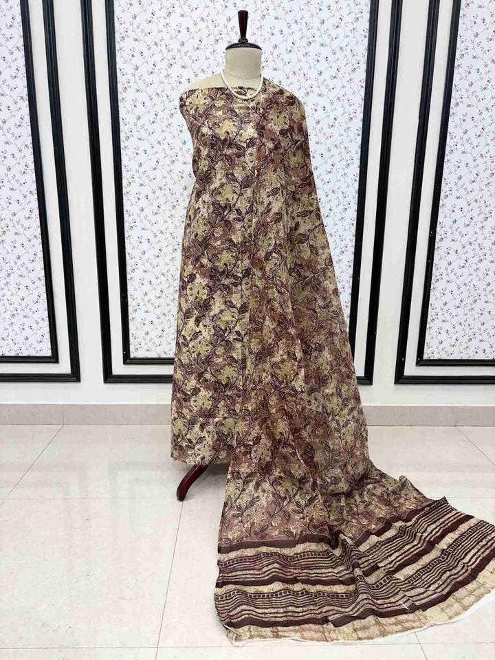 Brown and yellow cotton digital jaal print unstitched suit set displayed on mannequin