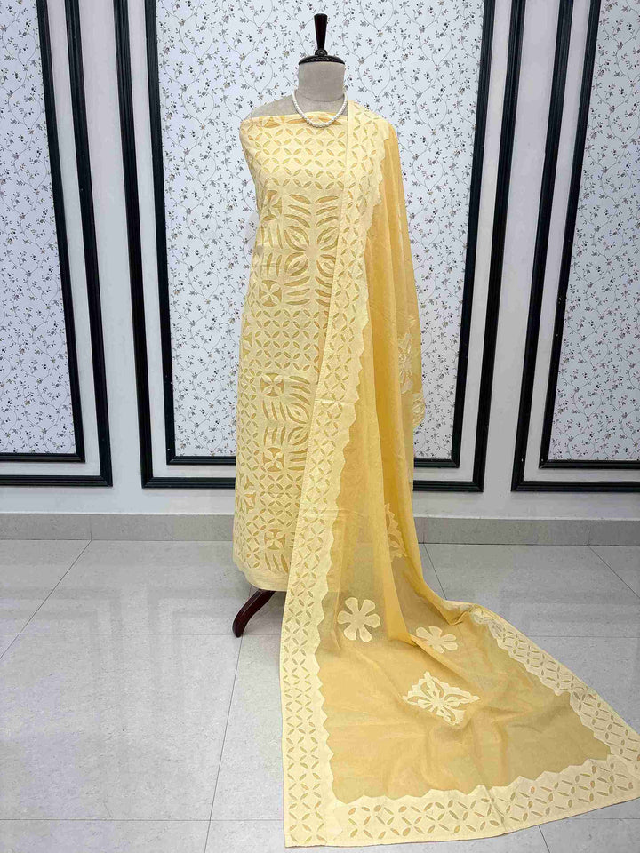 Butter yellow pure cotton unstitched salwar kameez with applique jaali work on shirt length and sleeves