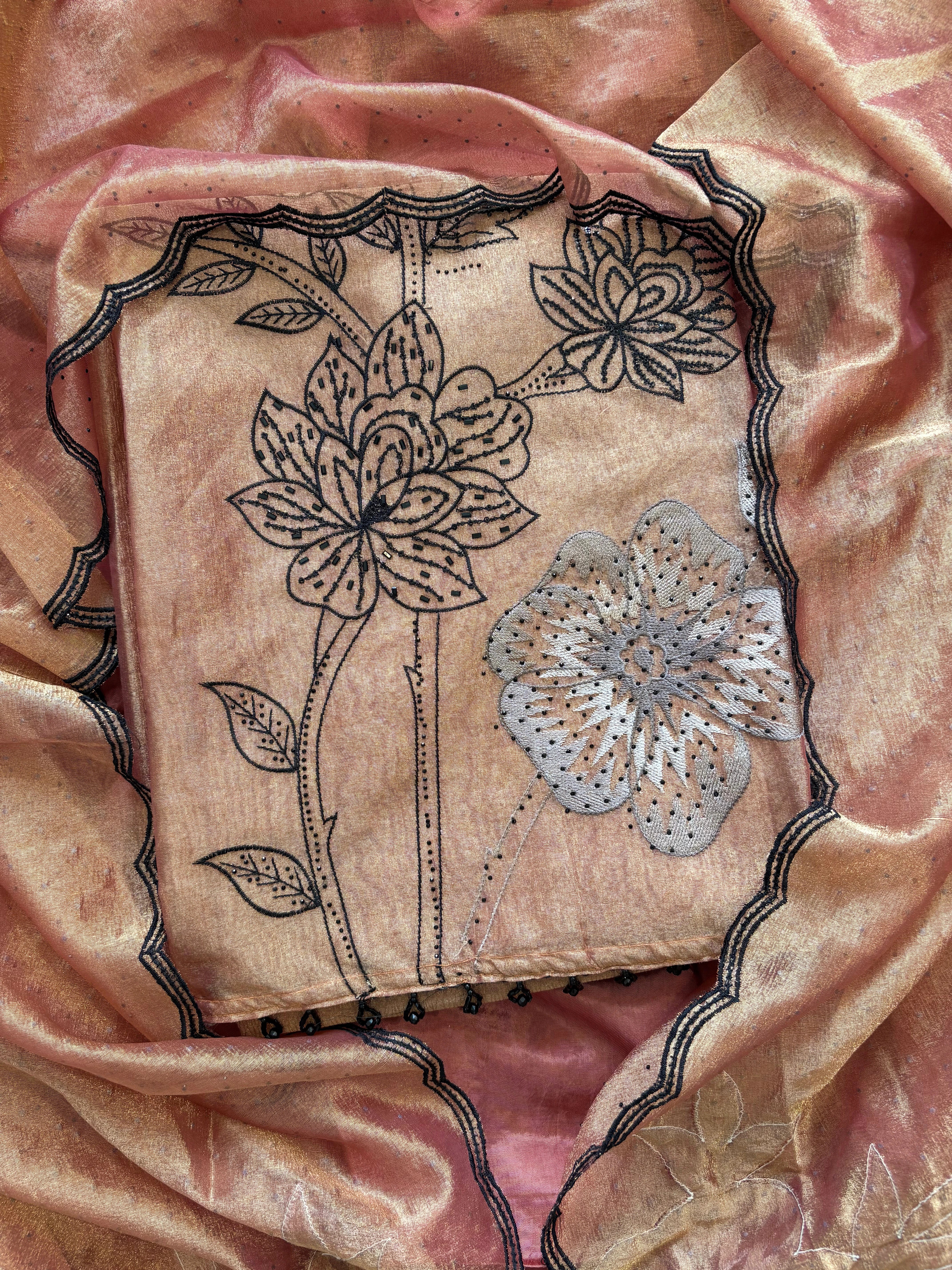 Rust glass tissue suit with intricate embroidery and organza dupatta – luxury ethnic wear for weddings and festive occasions.