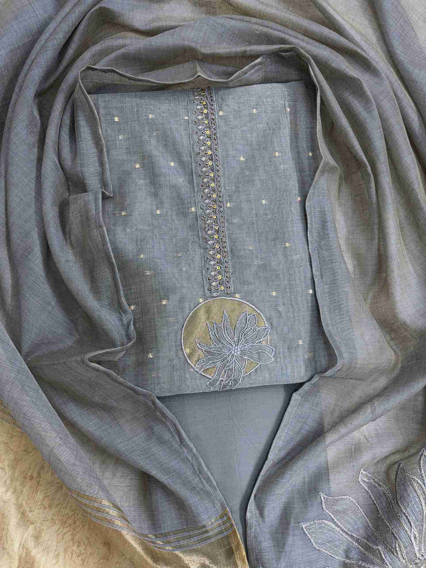 Grey Jamdani Cotton Unstitched Suit | Minimalist Applique Floral Neckline | Broad Gold Zari Patta Hemline & Applique Corner Dupatta Women's Suit