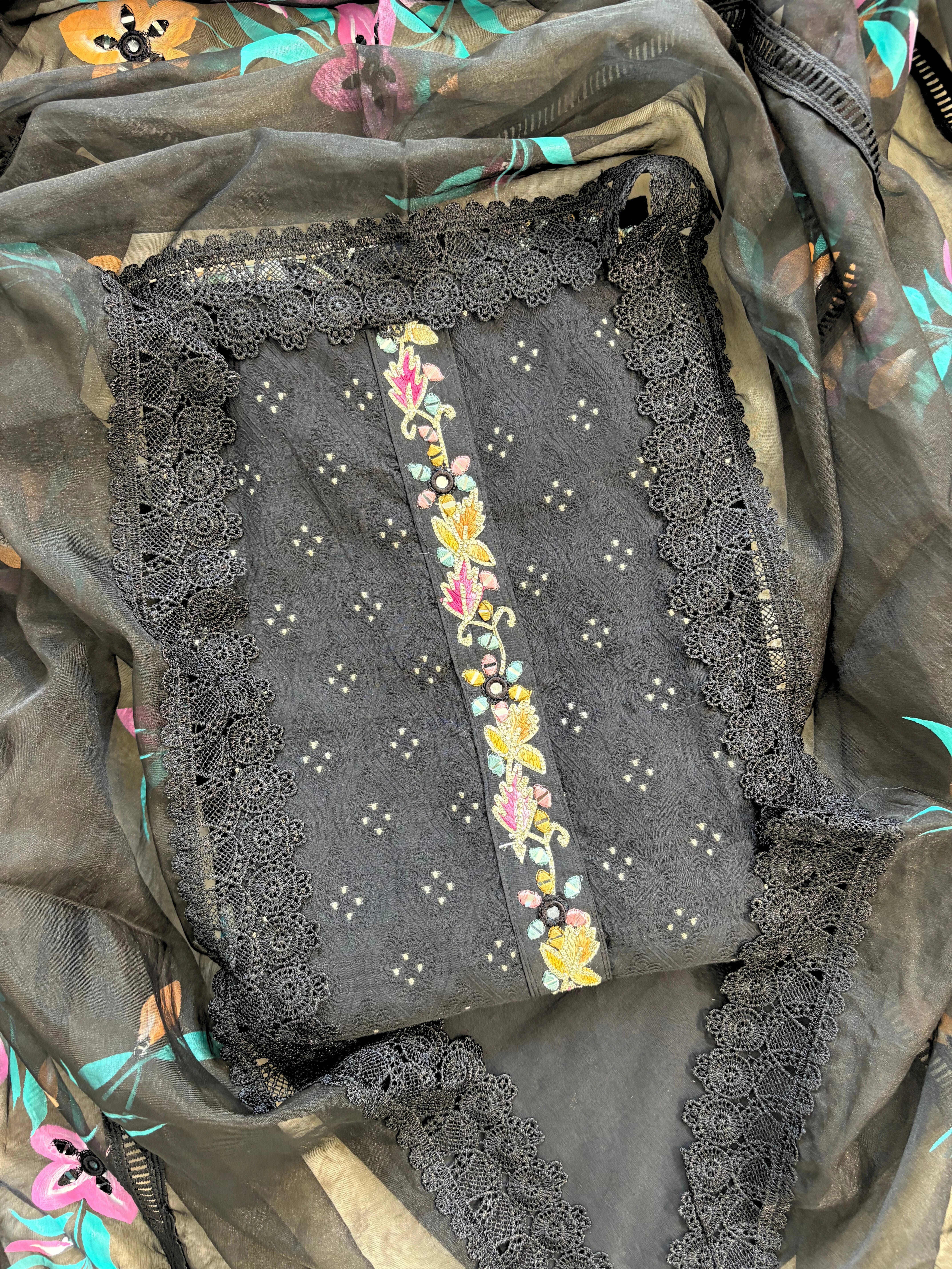black linen suit with embroidered detailing and hand-painted floral organza dupatta, finished with lace border – unstitched ethnic wear set