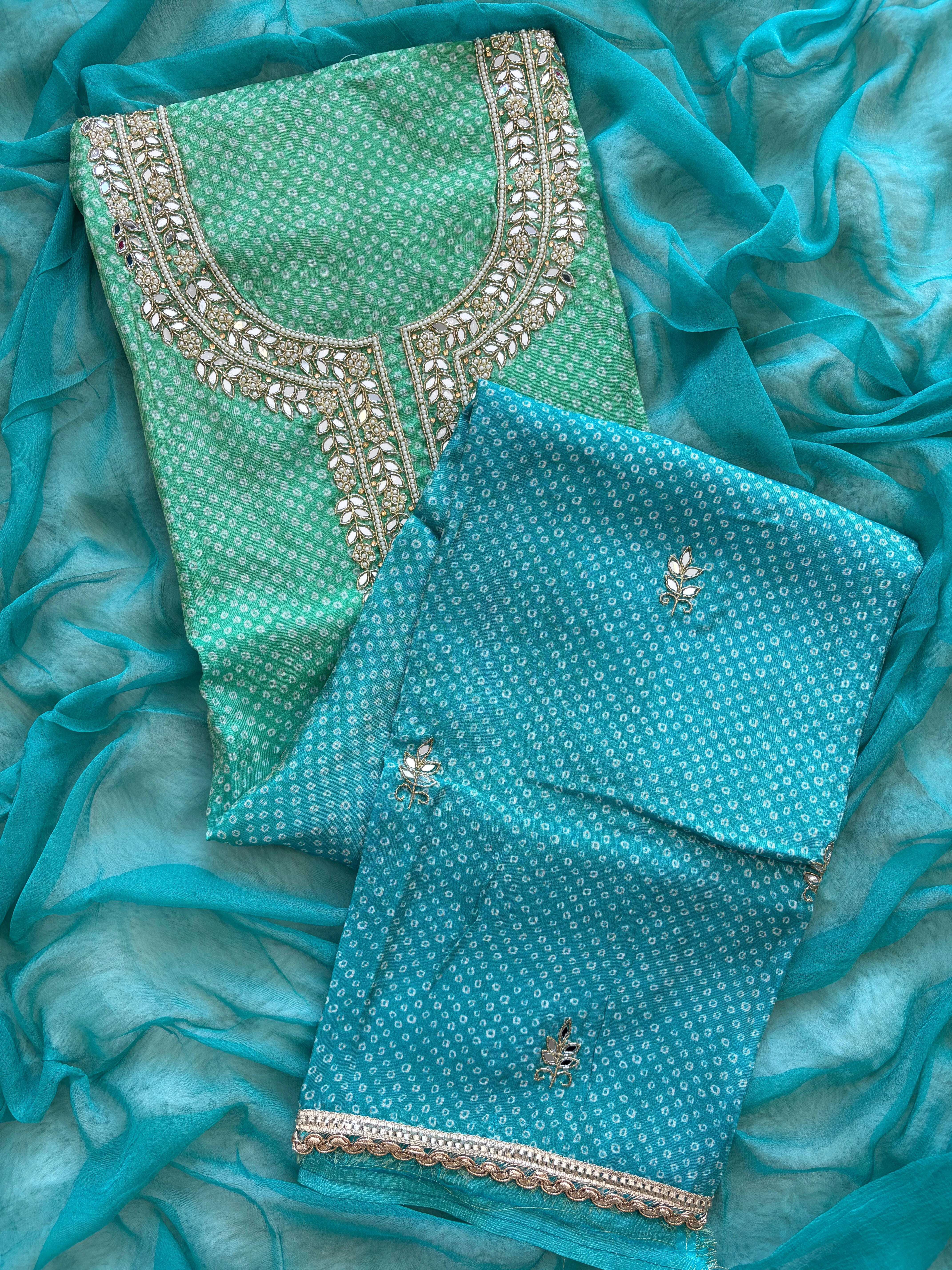 Blue Shimmer organza bandhani suit with ombre effect and chiffon dupatta with lace border.