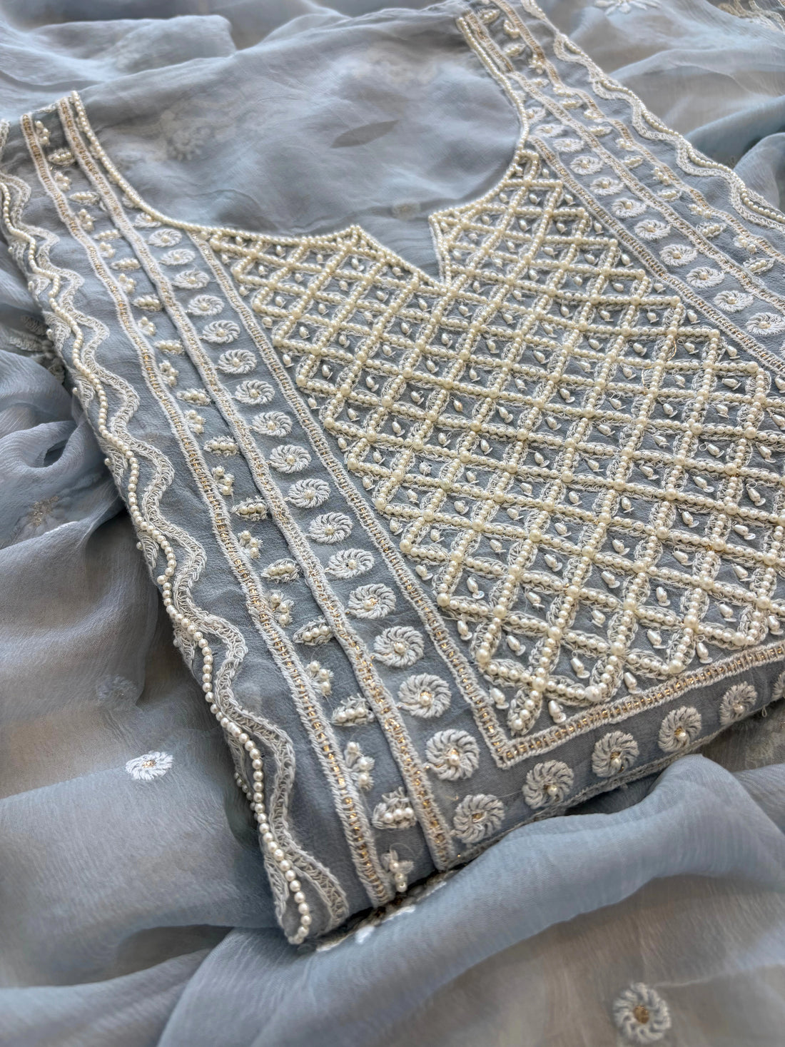 Powder blue georgette suit with moti highlighting and chiffon dupatta – embroidered festive ethnic wear for weddings and formal occasions.