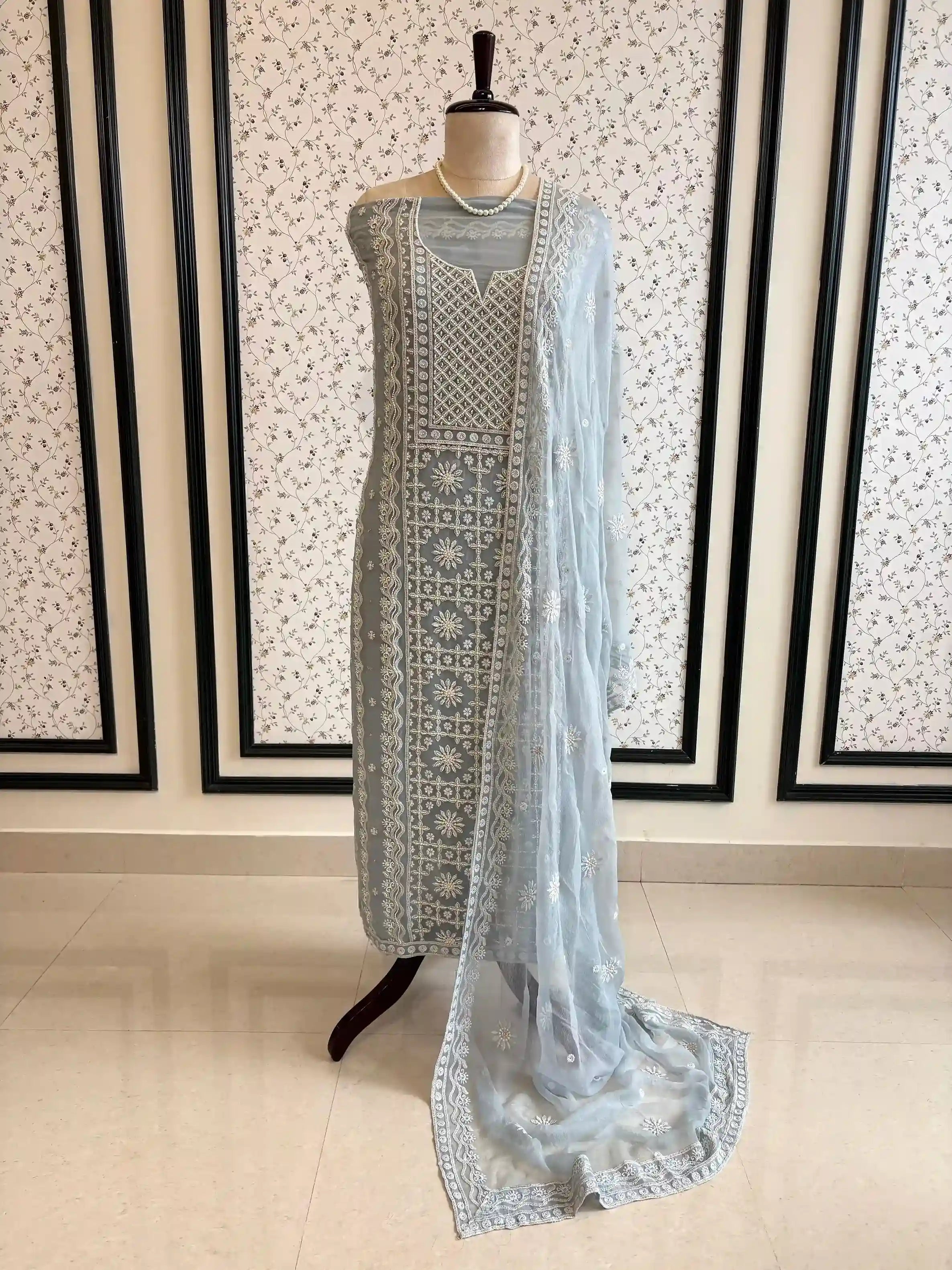 Powder blue georgette suit with moti highlighting and chiffon dupatta – embroidered festive ethnic wear for weddings and formal occasions.