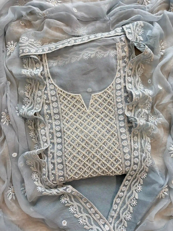 Powder blue georgette suit with moti highlighting and chiffon dupatta – embroidered festive ethnic wear for weddings and formal occasions.