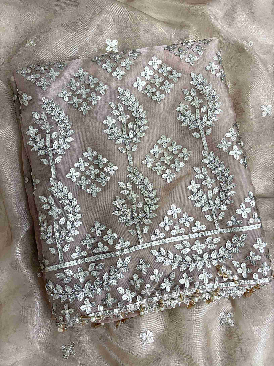 Scattered silver gota motifs across the full body of champagne beige tissue unstitched shirt