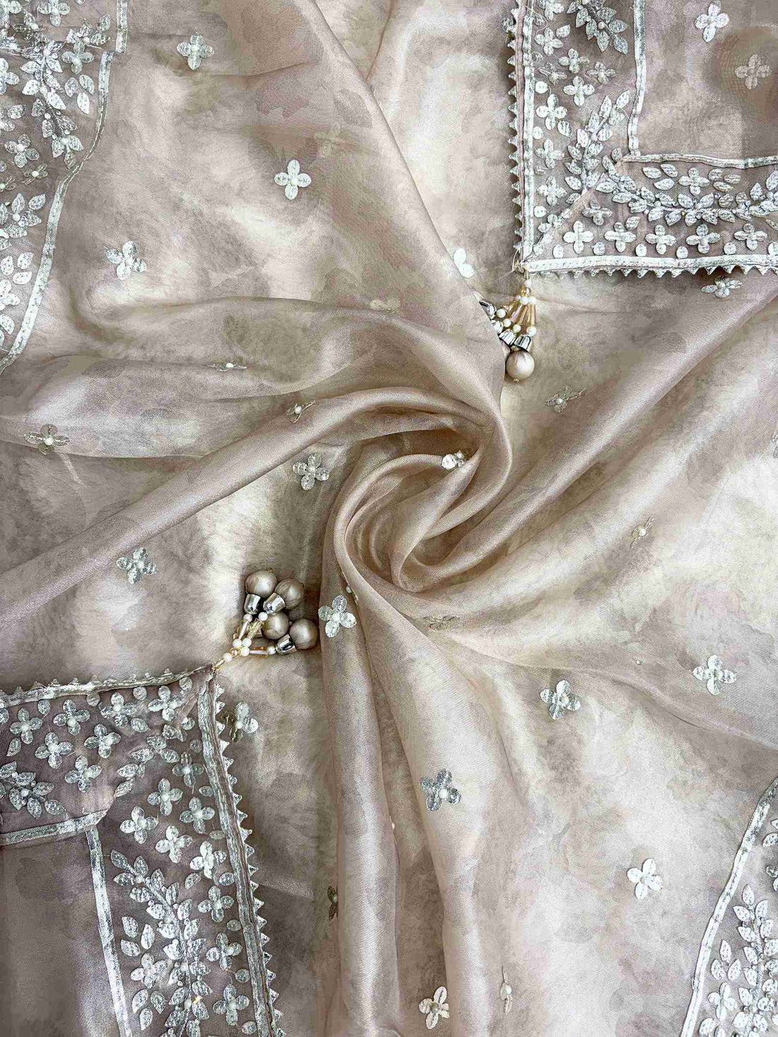 Champagne beige opada silk bottom fabric detail with pearl tassel at tissue dupatta end