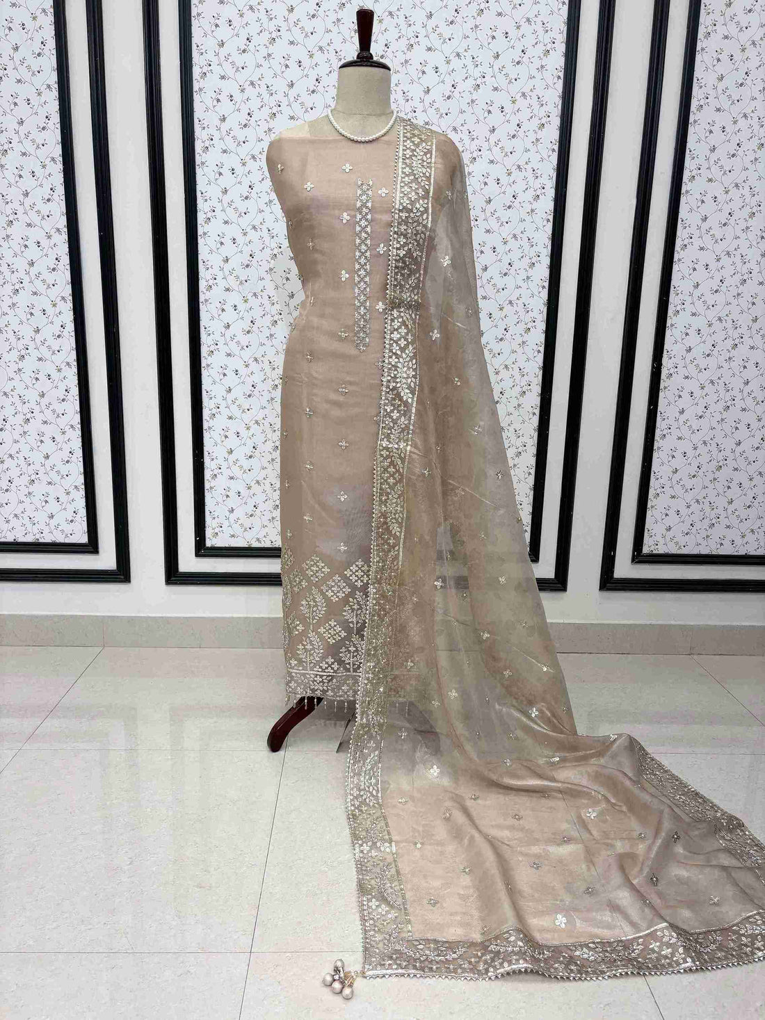Champagne beige tissue unstitched suit full front view with four-sided gota border dupatta draped on mannequin