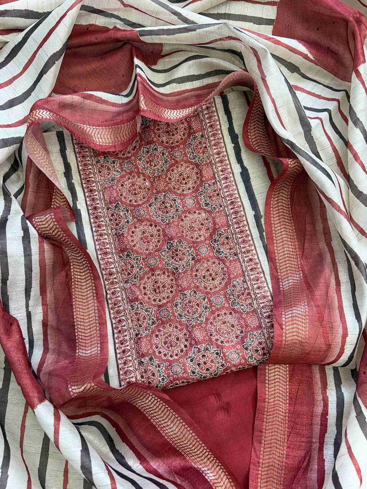 Chanderi unstitched suit with Ajrakh printed neckline and solid kurta design