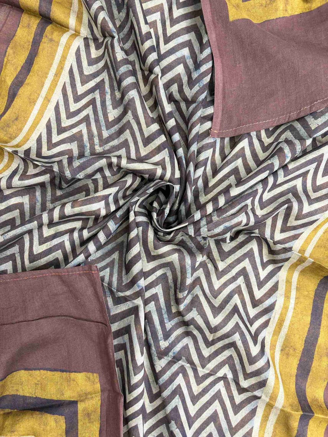 Large olive and blue floral motifs at end panel with brown and olive stripe border on charcoal grey mul cotton dupatta