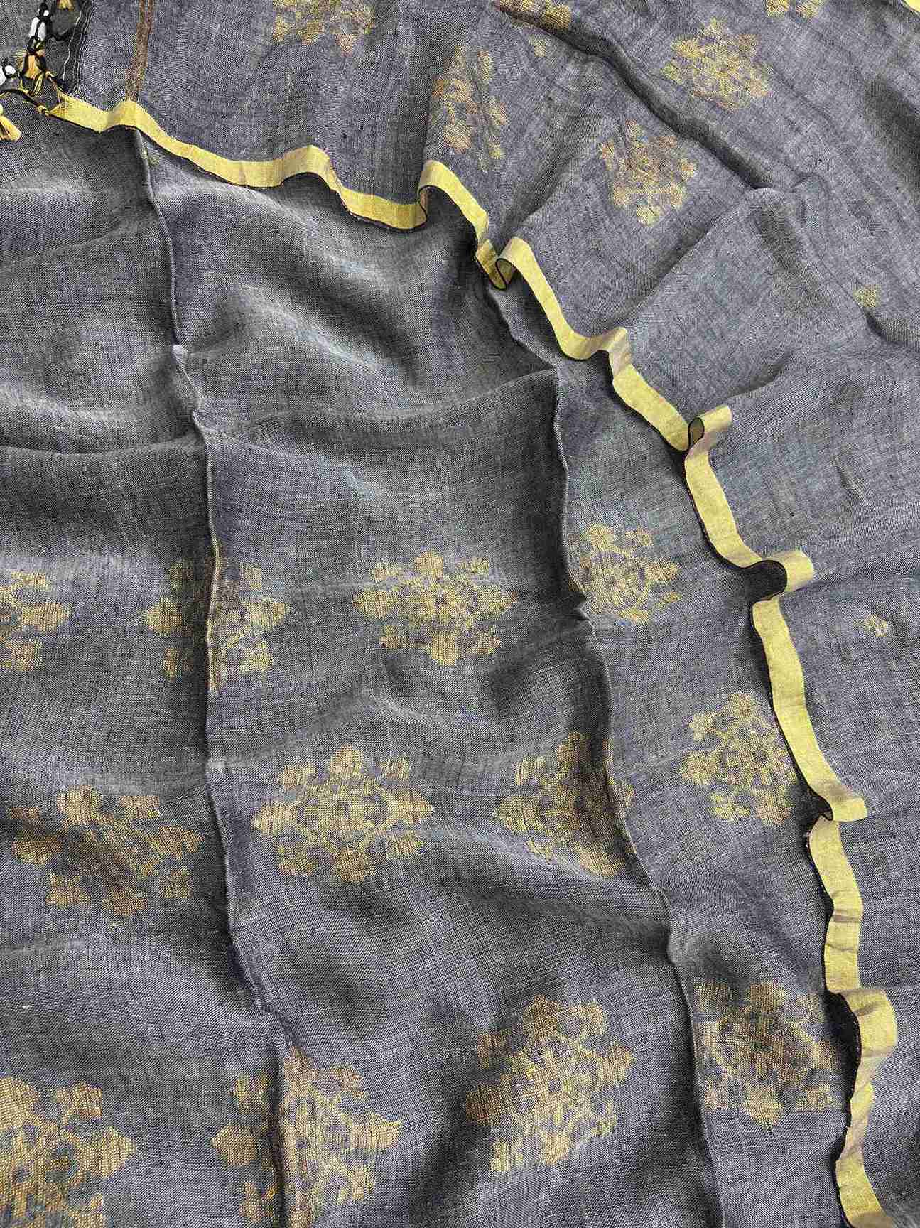 Scattered golden woven floral cluster motifs across charcoal grey pure handloom linen shirt body