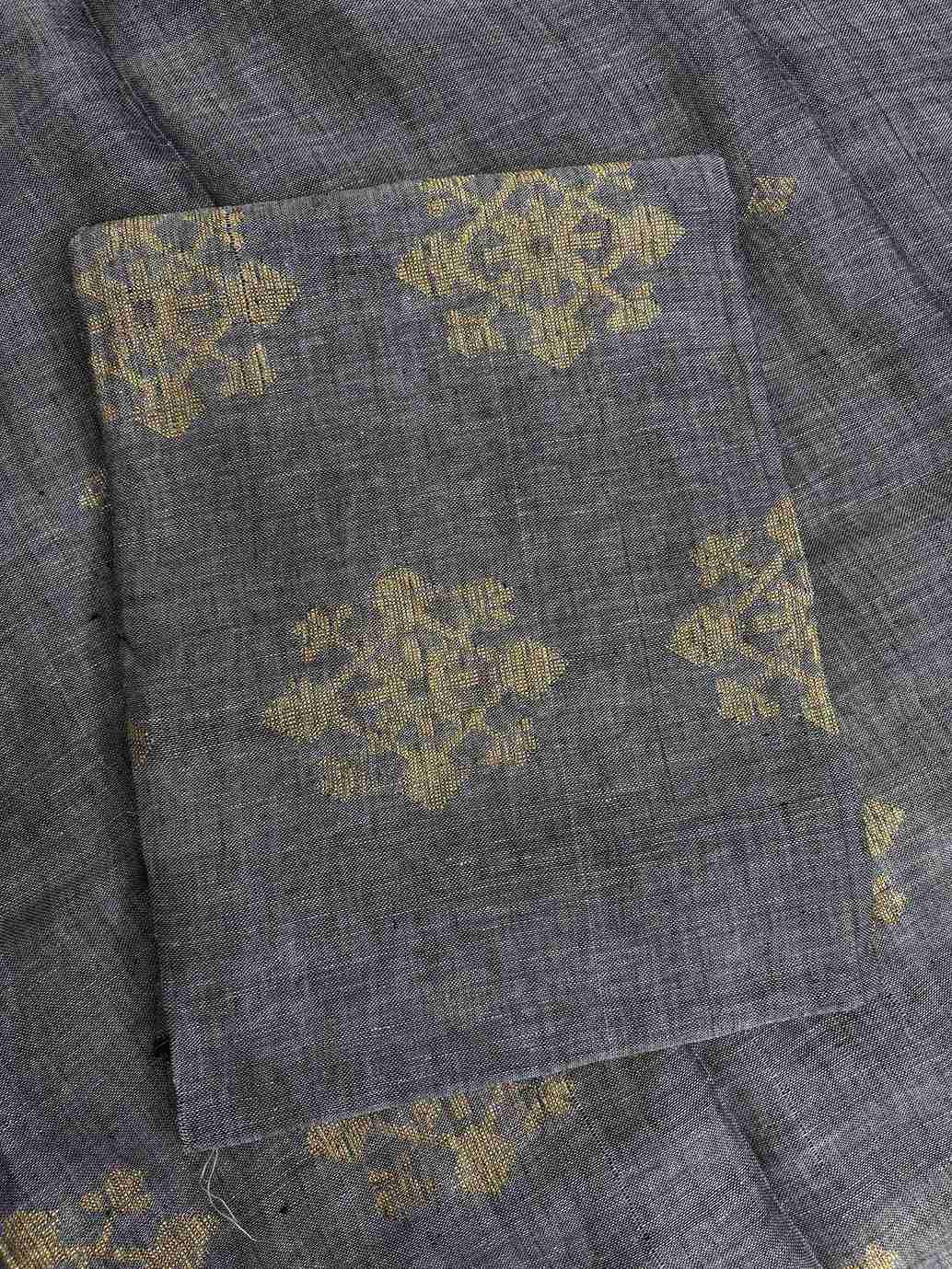 Natural slub texture and organic weave of charcoal grey pure handloom linen shirt fabric close-up