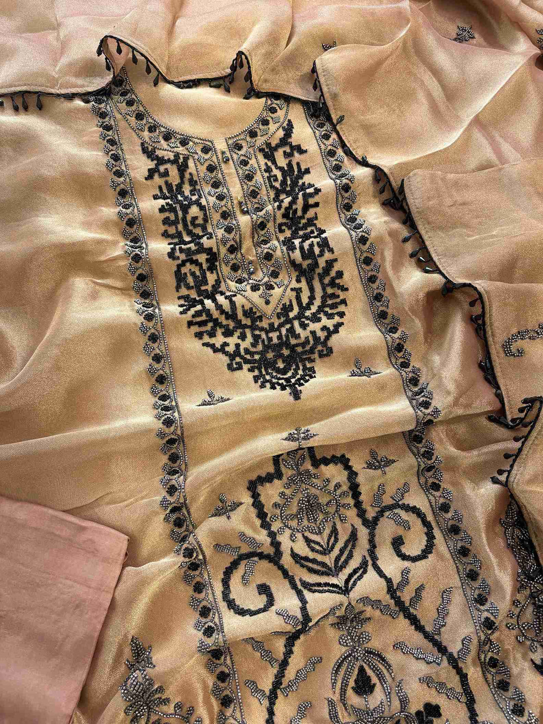 Copper beige giraffe tissue unstitched suit set flatlay with dupatta and opada silk bottom