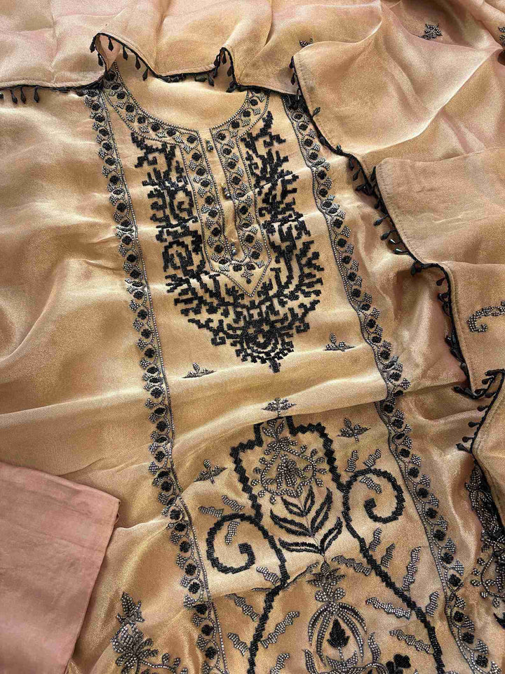 Copper beige giraffe tissue unstitched suit set flatlay with dupatta and opada silk bottom