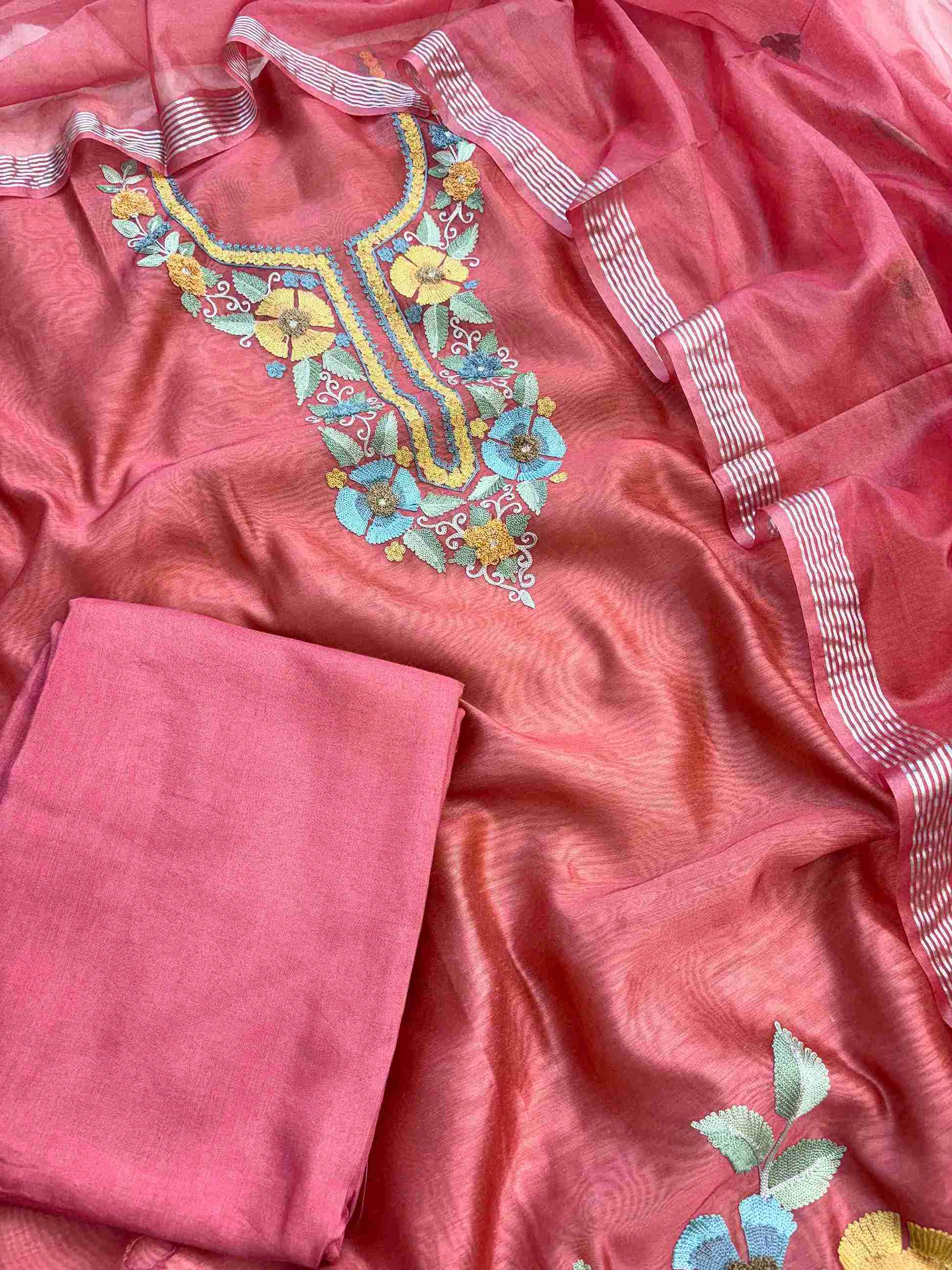 Coral pink cotton silk bottom fabric flatlay