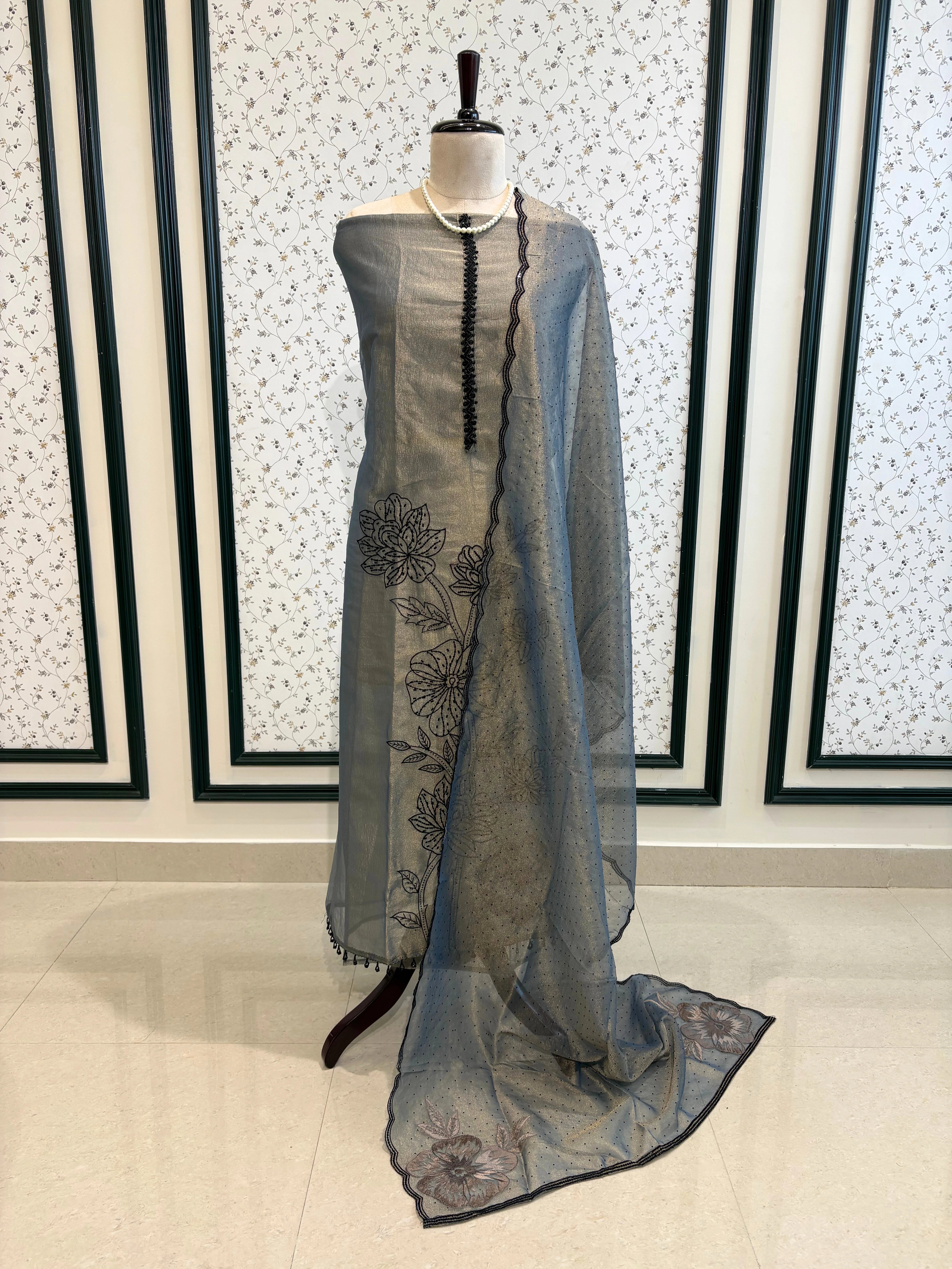 Grey glass tissue suit with intricate embroidery and organza dupatta – luxury ethnic wear for weddings and festive occasions.