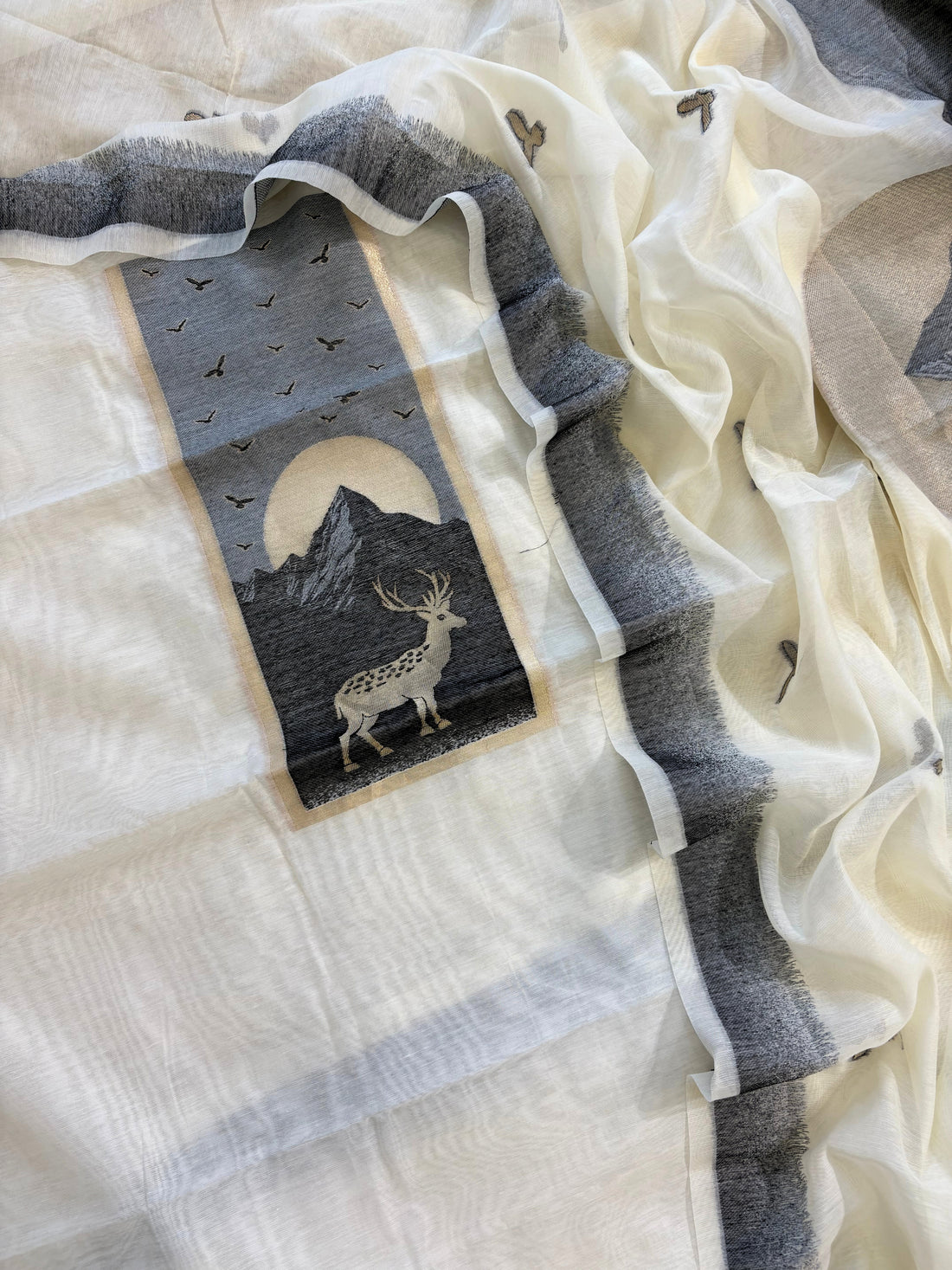 Grey and ivory Jamdaani suit with woven mountain, deer, and bird motifs, made with fine handloom weaving, perfect for winter and festive occasions.