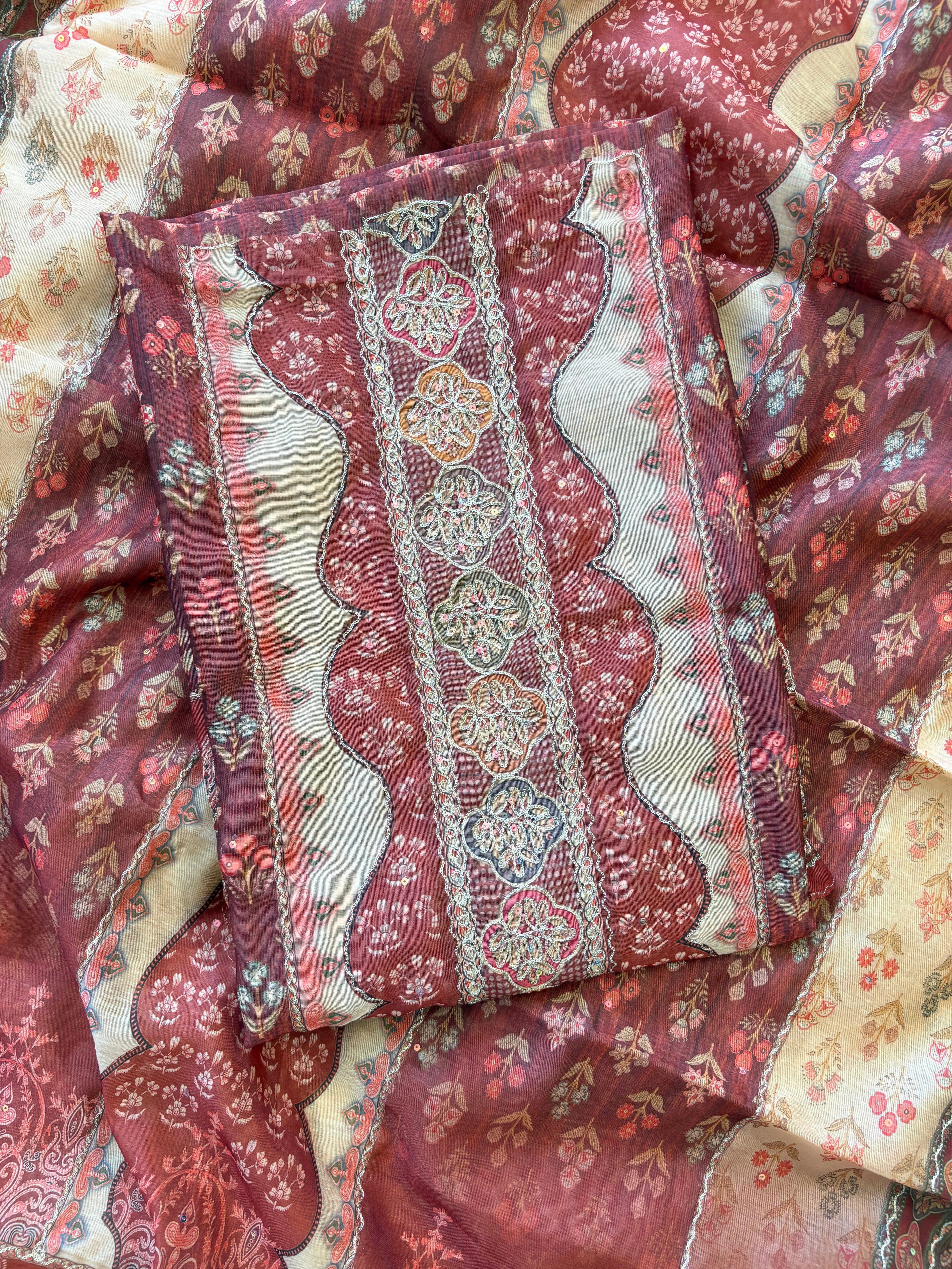 Rust red chanderi suit with golden weave and printed chanderi dupatta featuring tassel edging.