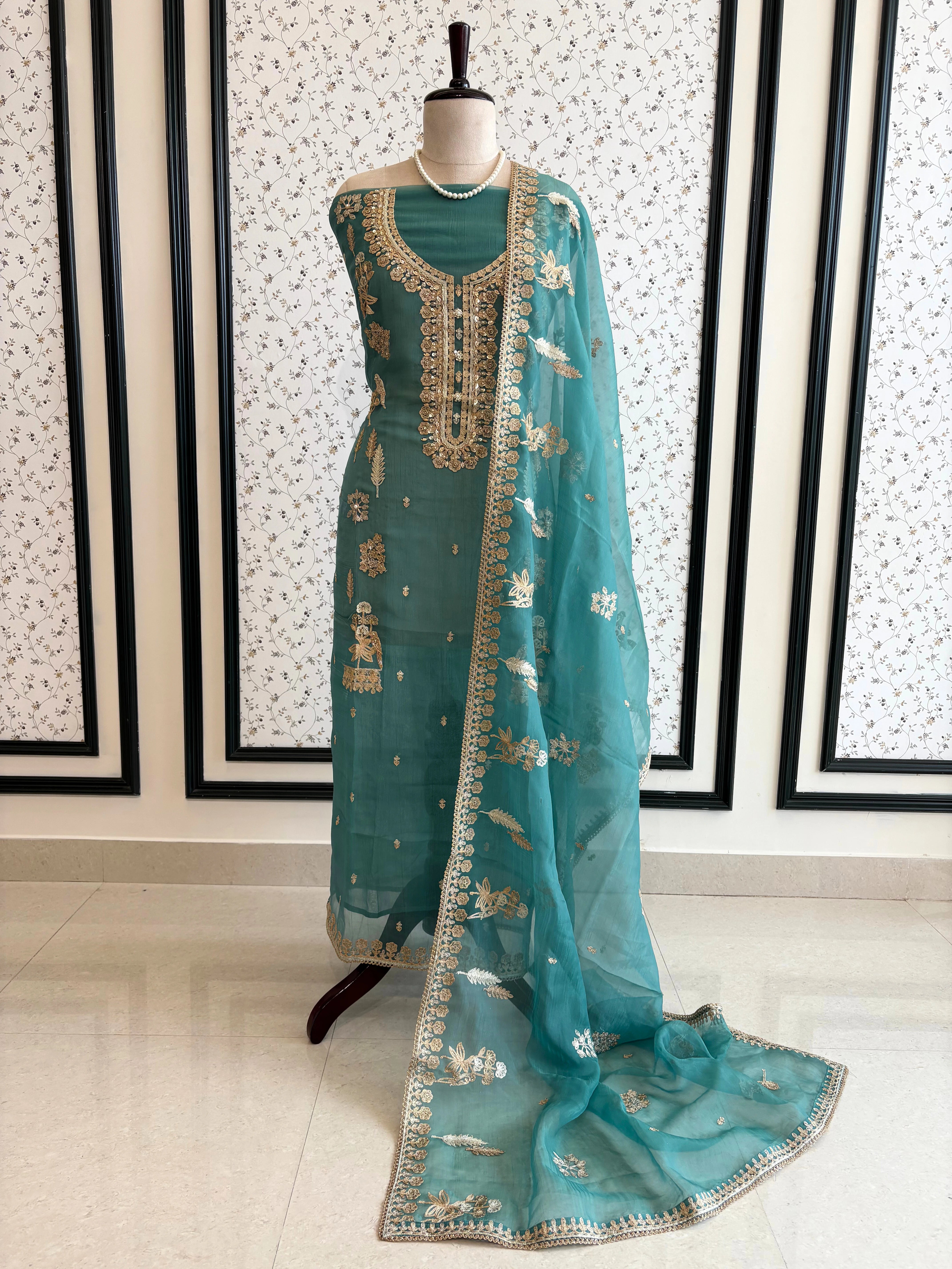 organza unstitched suit with zari work and parrot figure