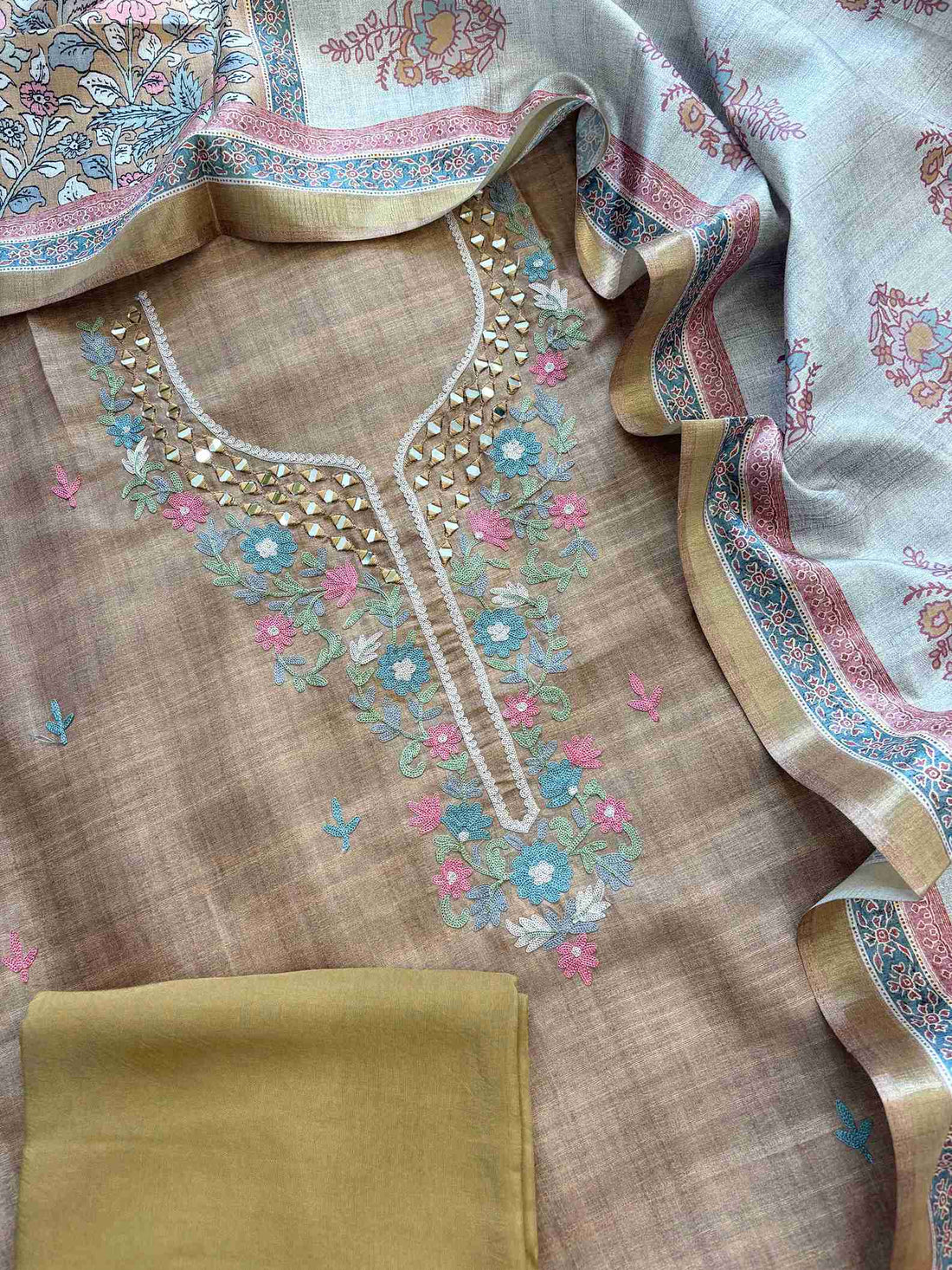 Mirror and aari work detailing on daaman of tusser silk shirt