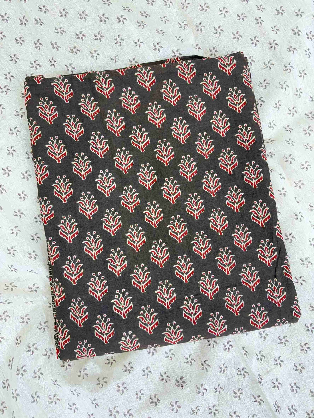 All-over ajrak block print booties in red and cream tones across dark brown pure cotton shirt body