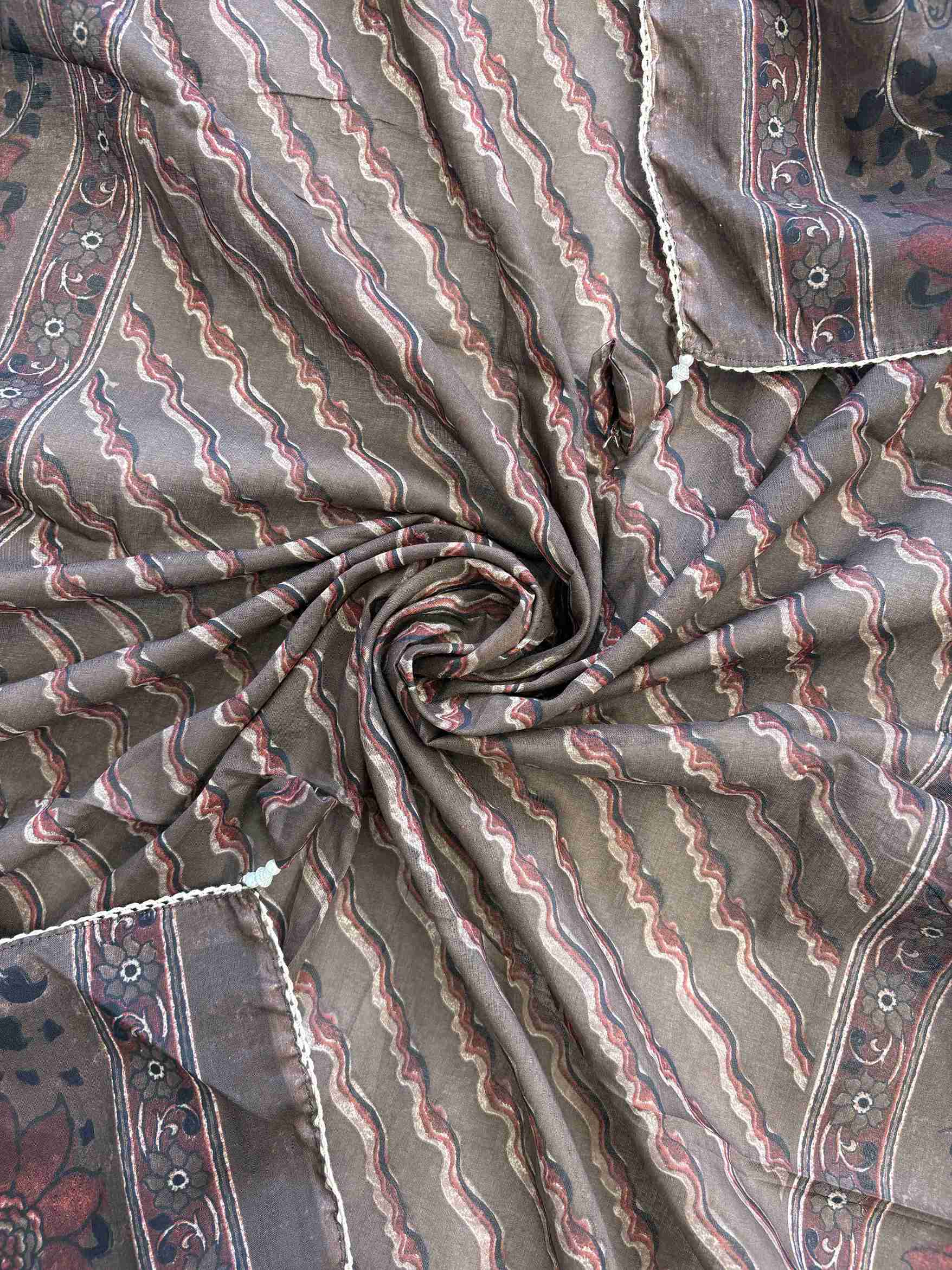 All-over floral print with wave stripe pattern and crotia lace border on dark chocolate brown cotton dupatta