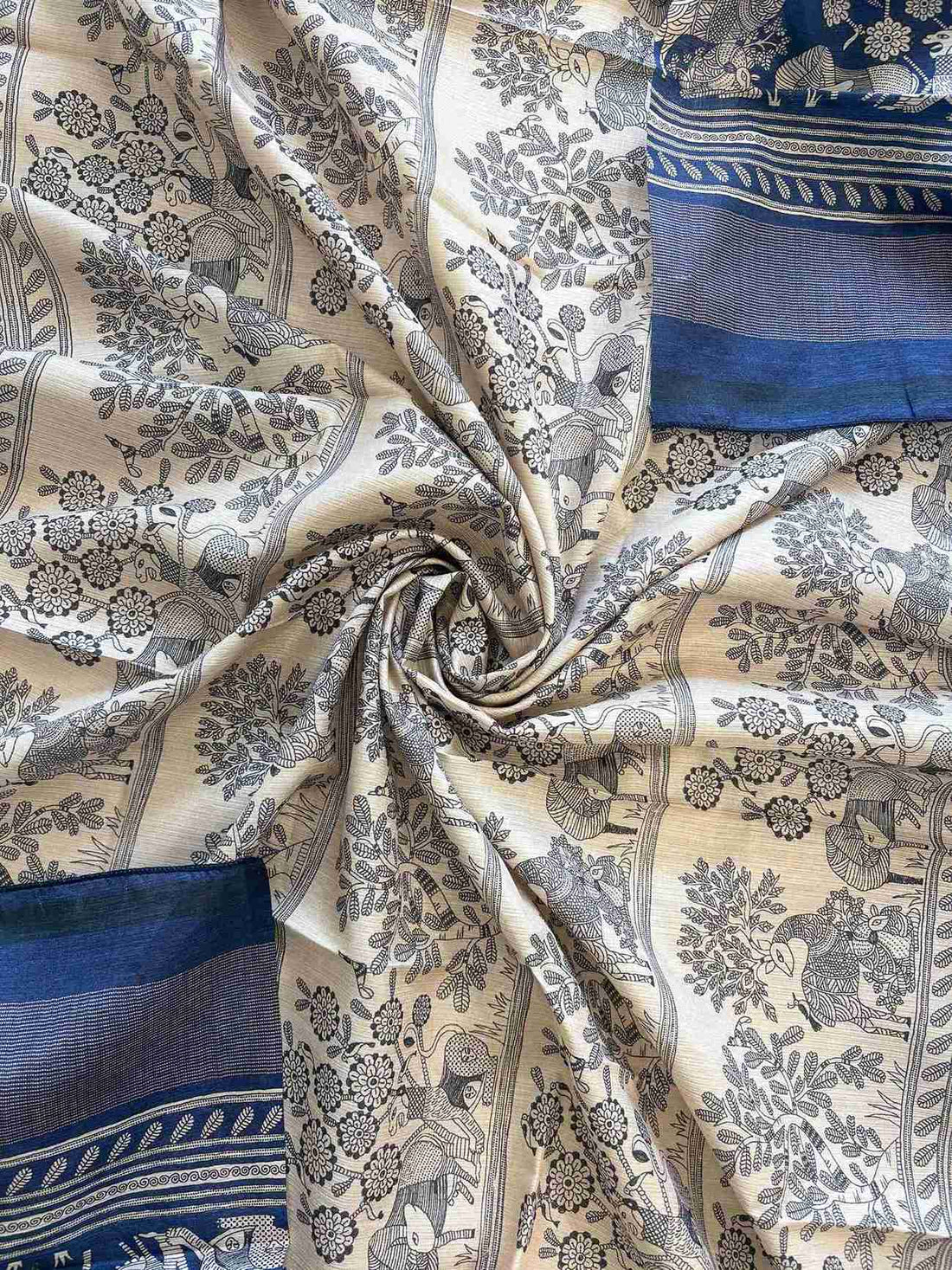 Cream hemline border with printed animal-tree scene on deep blue chanderi silk suit