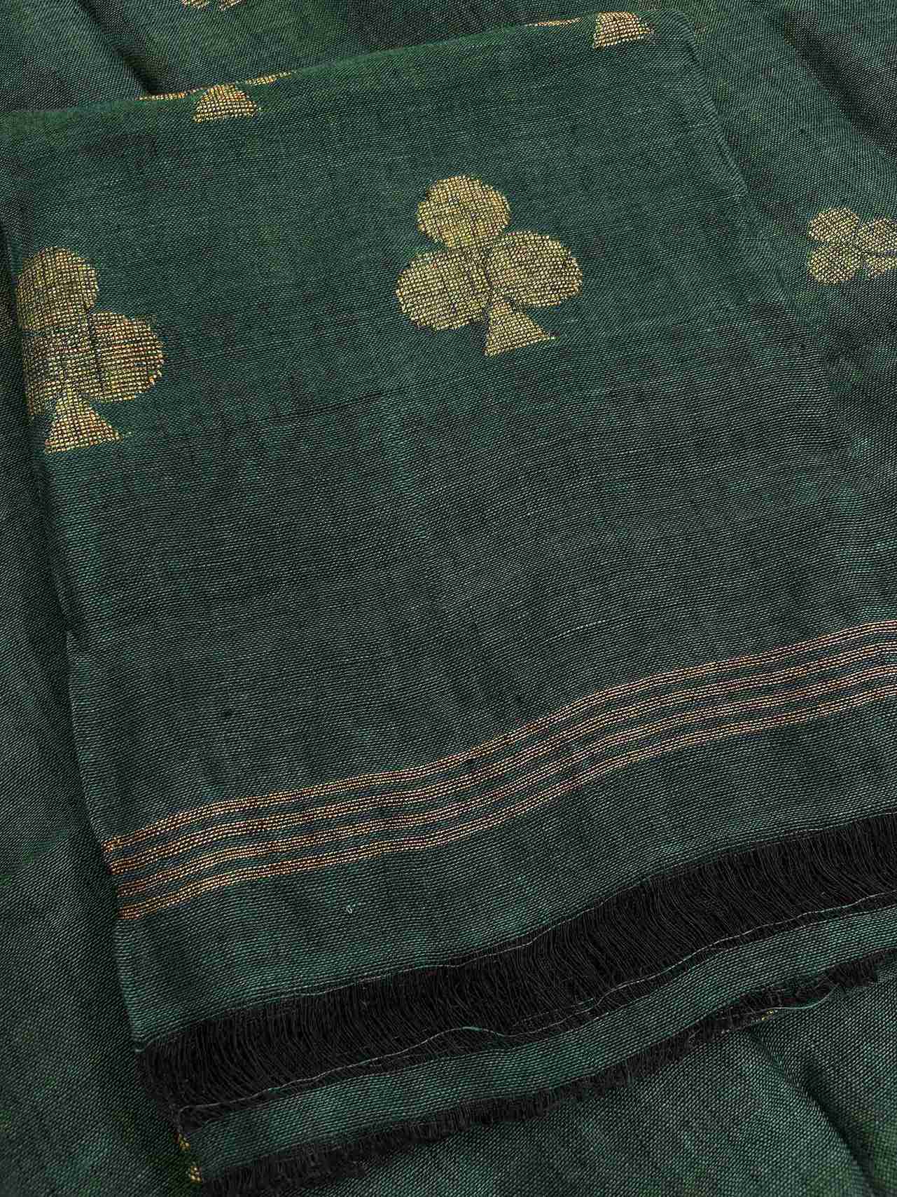 Natural slub texture and organic weave of deep green pure handloom linen shirt fabric close-up