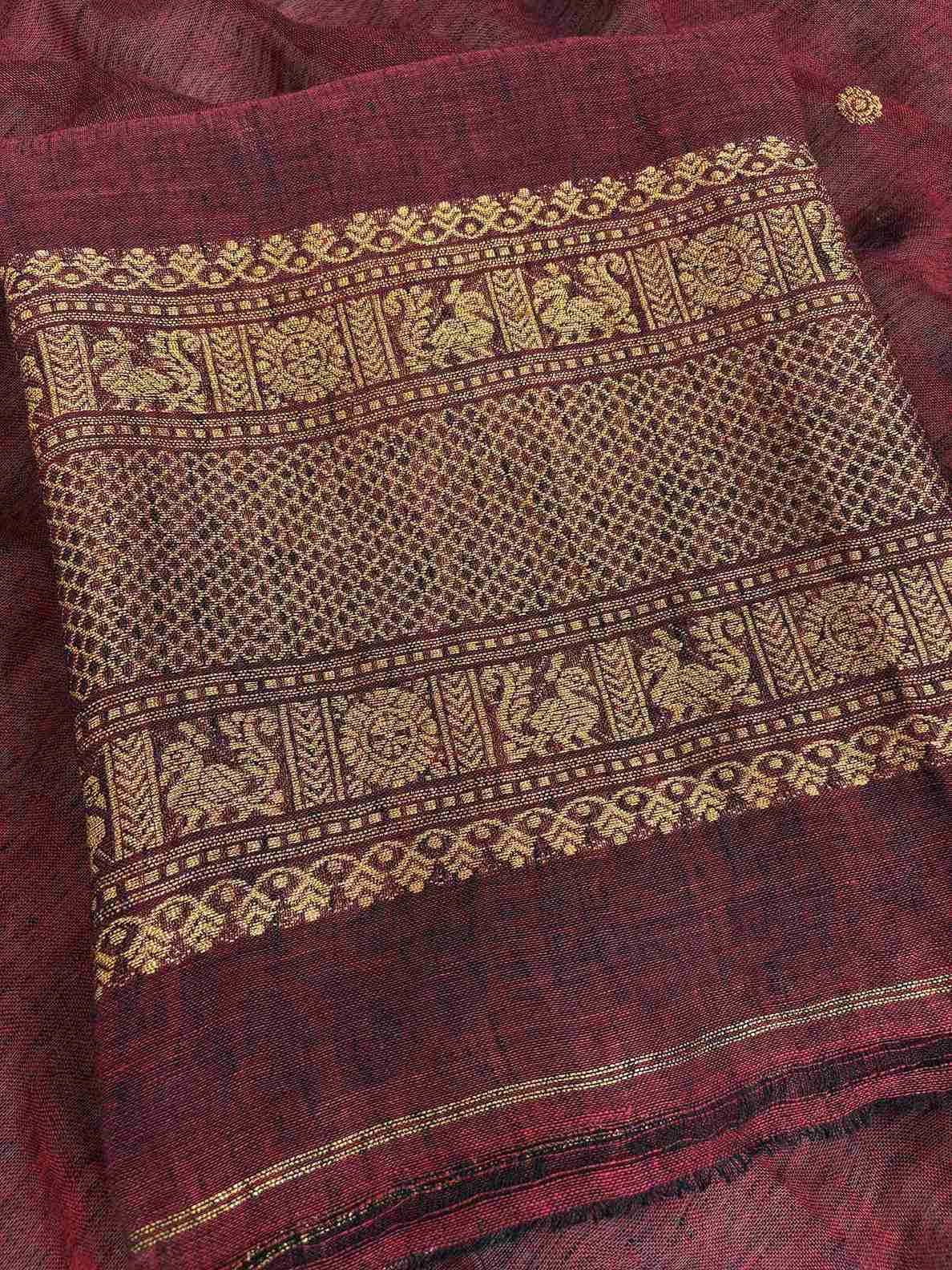 Scattered golden zari booties across the body of deep maroon jaishree linen unstitched shirt