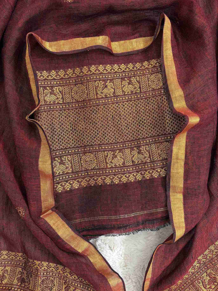 Broad zari woven daaman with animal motifs, geometric lattice, and floral border bands on deep maroon jaishree linen shirt